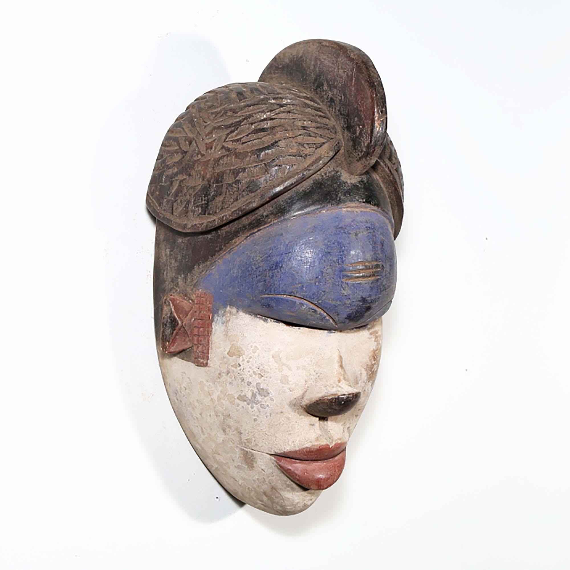 Igbo Style African Mask from Nigeria in blue as a wall decor idea right side