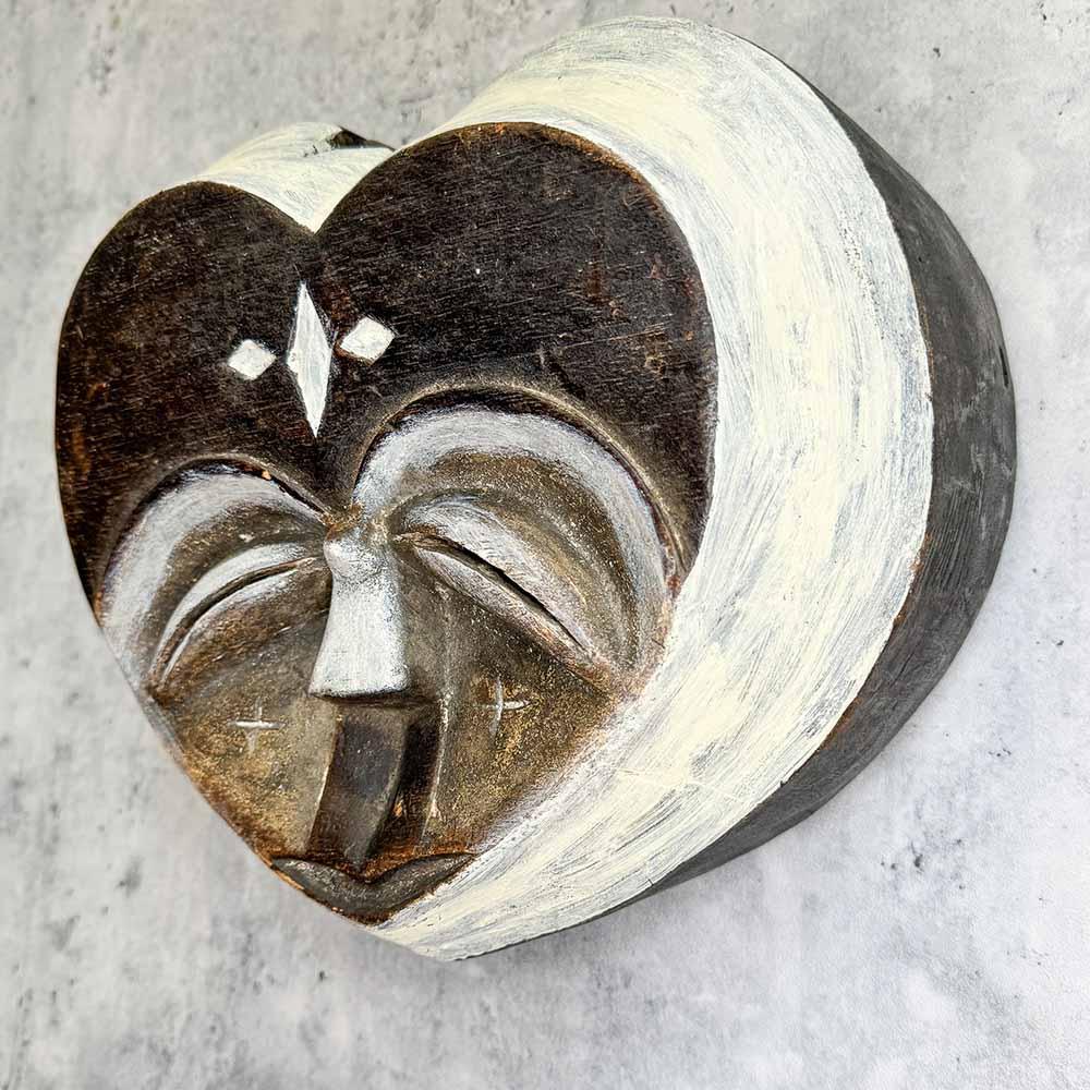 Kwele Mask from Congo as a wall decor ideas left side