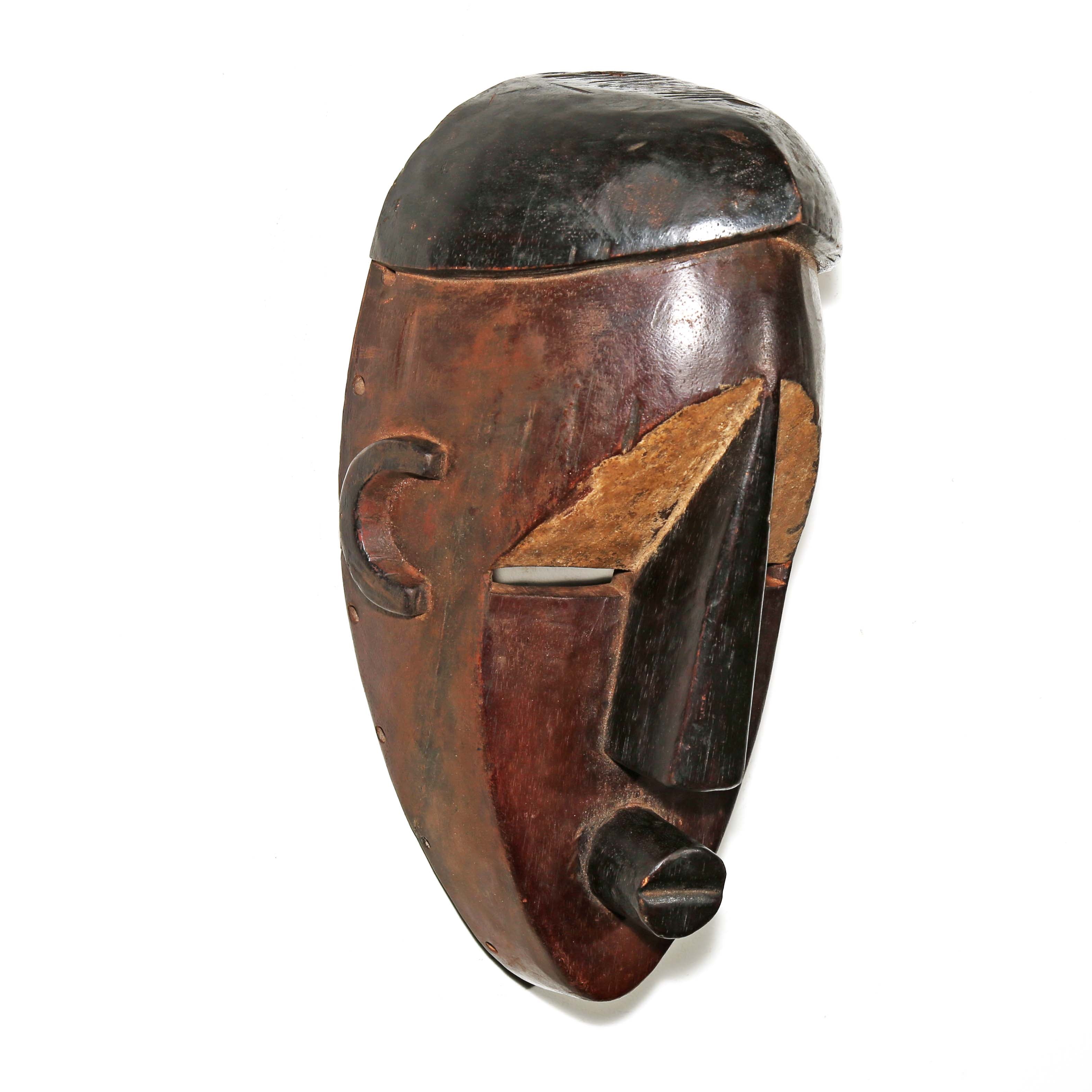 Brown and black African wood wall mask