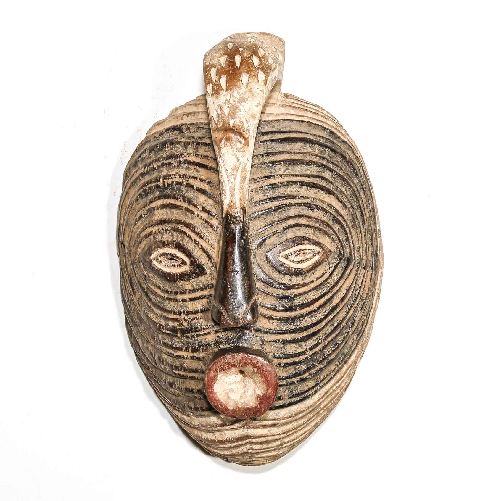Decorative wood mask with textured surface and brown accents on a white background