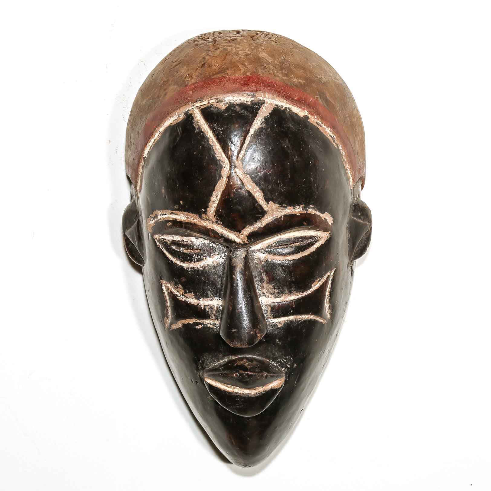 African mask with black face and brown top on a white background