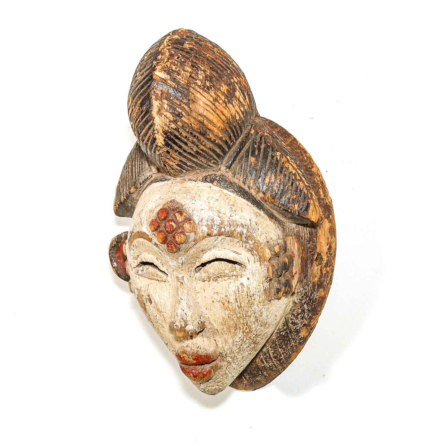 Wooden African mask with detailed rustic facial features and hair on a white background