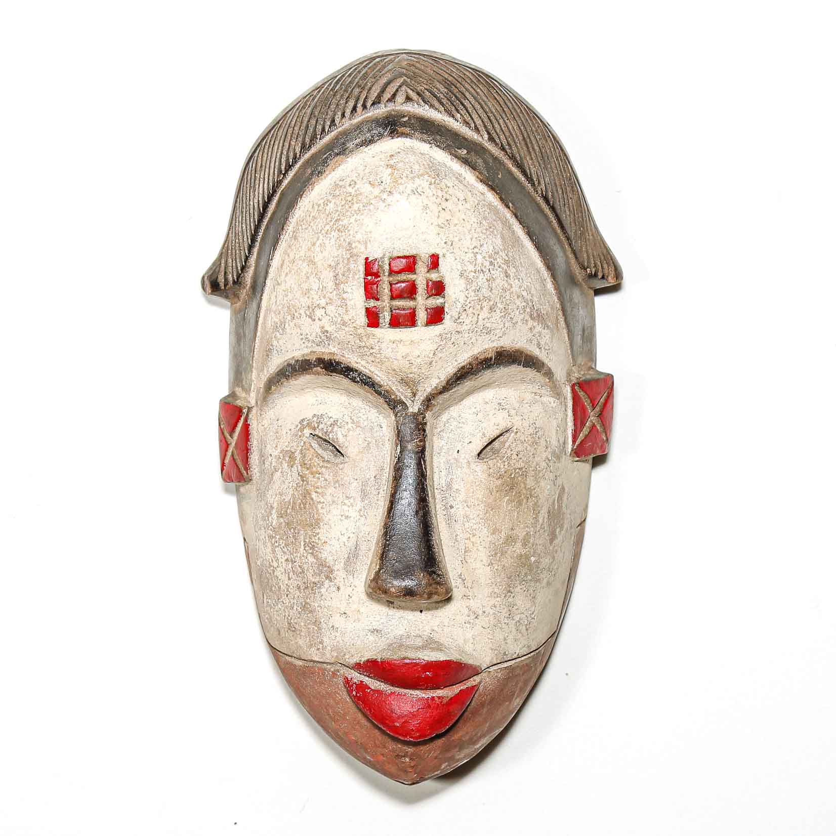 African mask with red accents on a white background