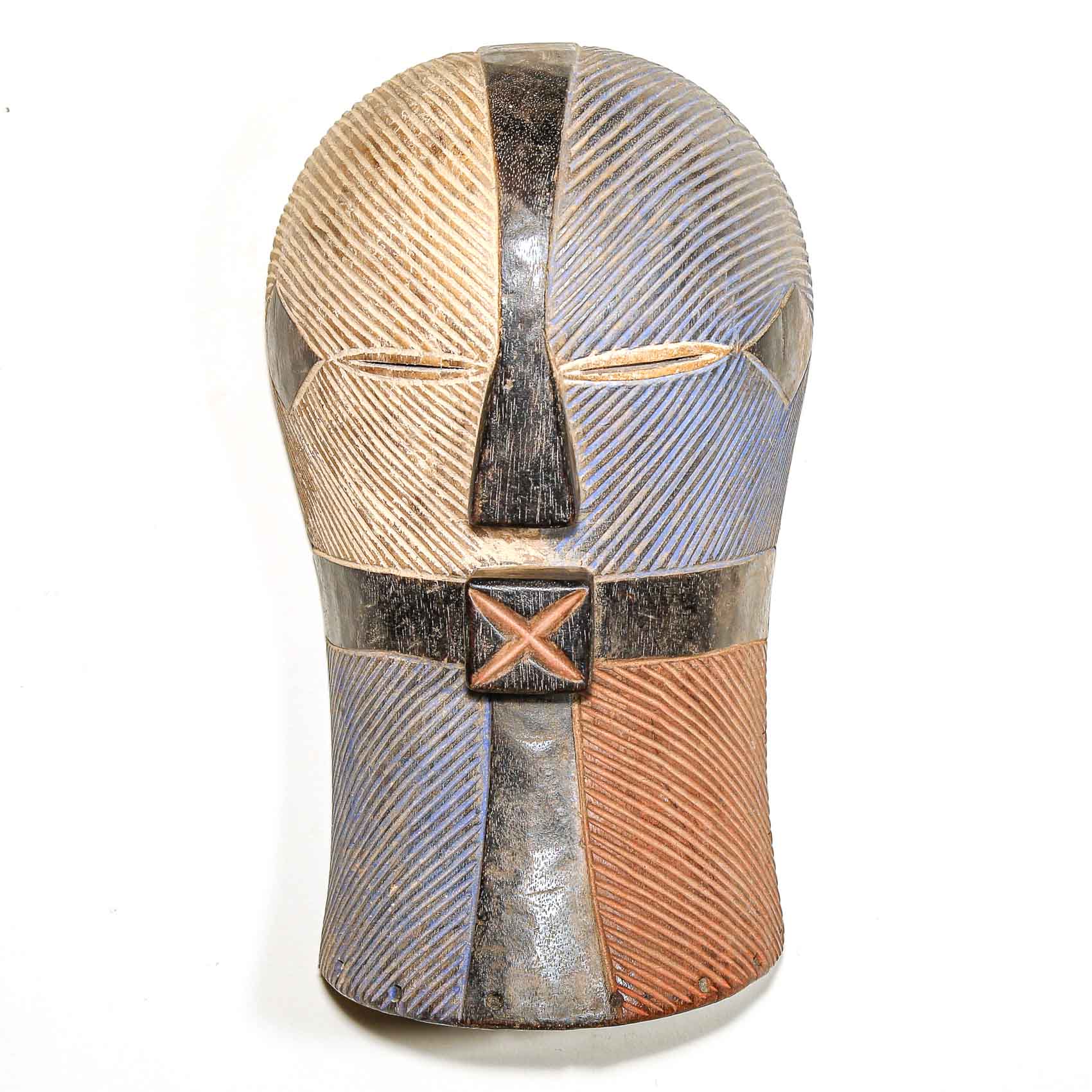 African carved wood mask with geometric patterns on a white background