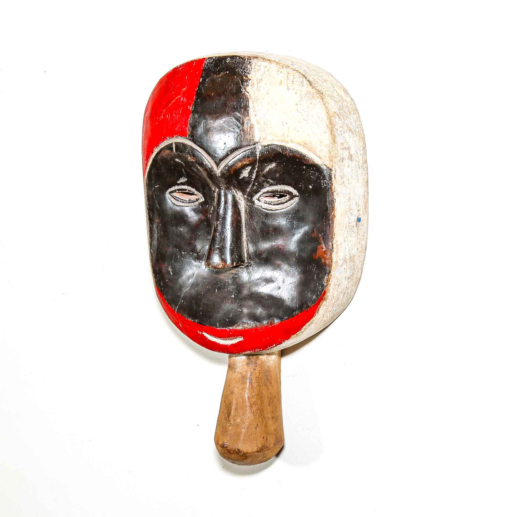Traditional mask with a wooden handle on a white background