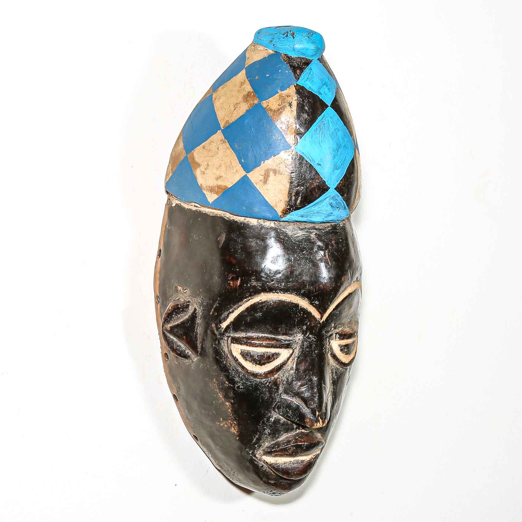Black mask with a blue and white headdress on a white background