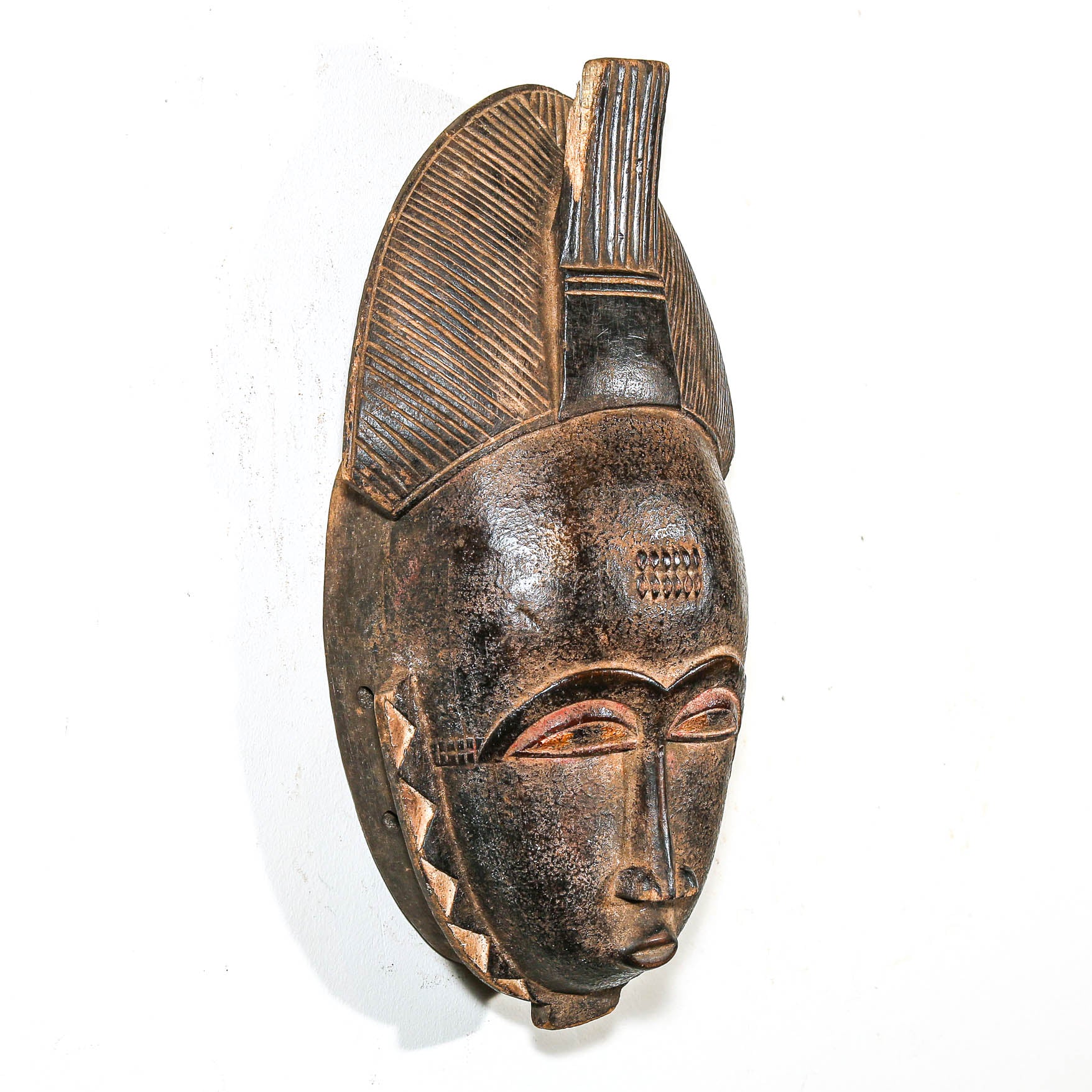 African wooden mask on a white background African decor