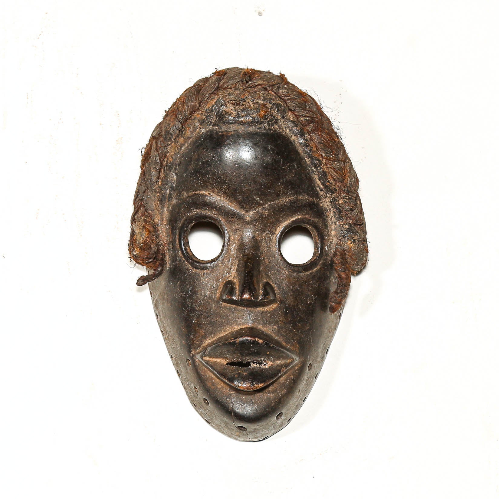 Traditional Black African mask on a white background