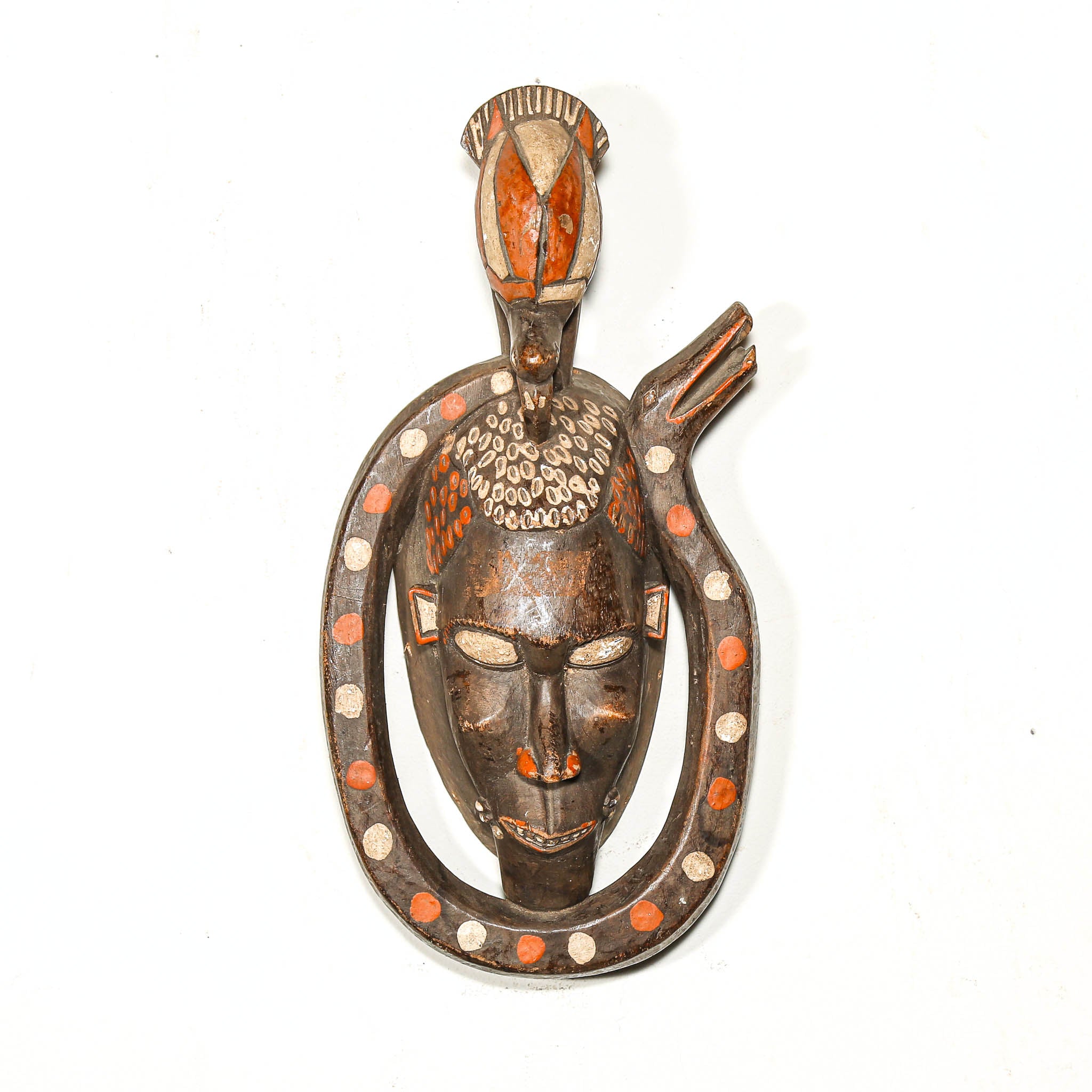Decorative wall hanging with an African head design on a white background