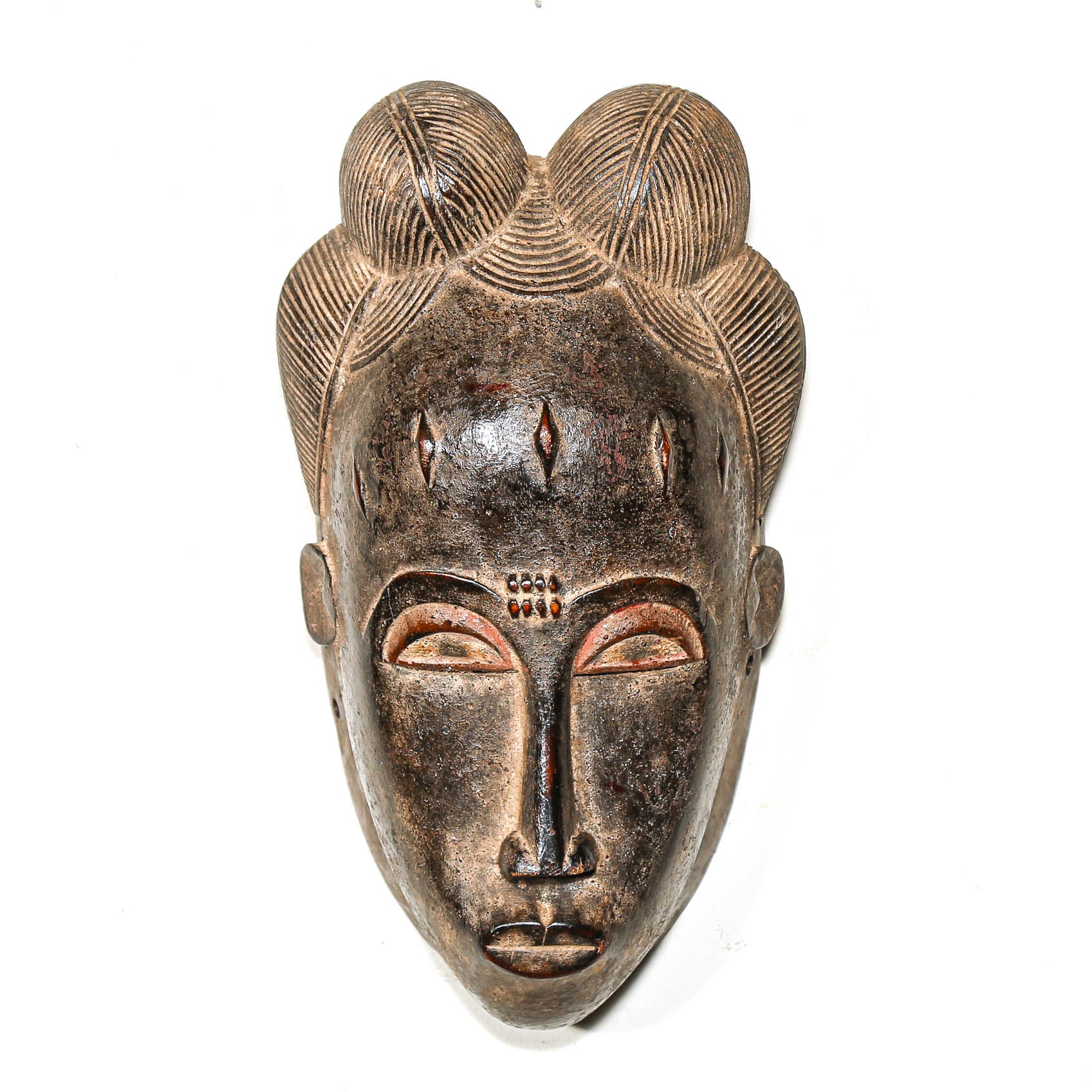 fine African mask with black intricate design on a white background