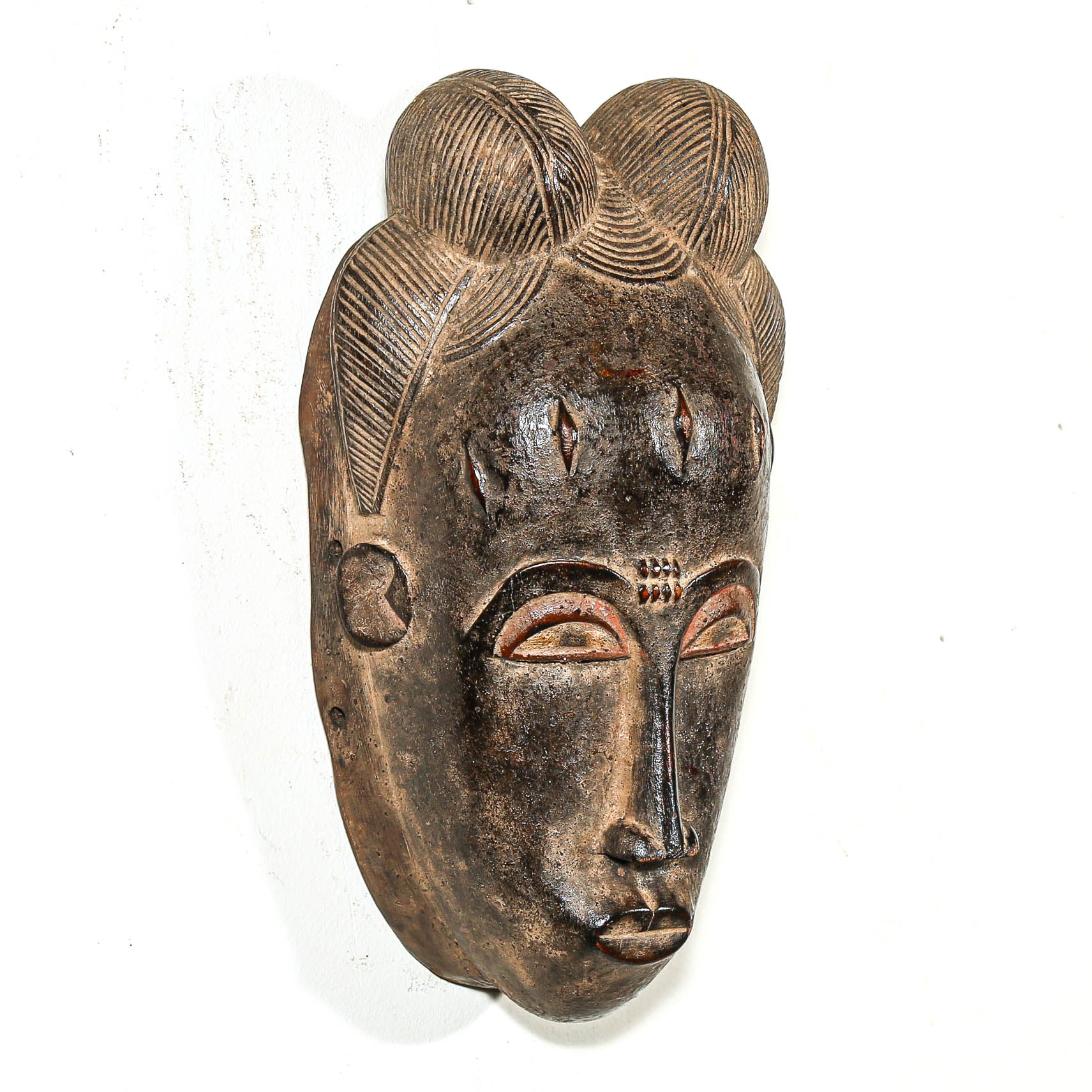 African-style wooden mask on a white background