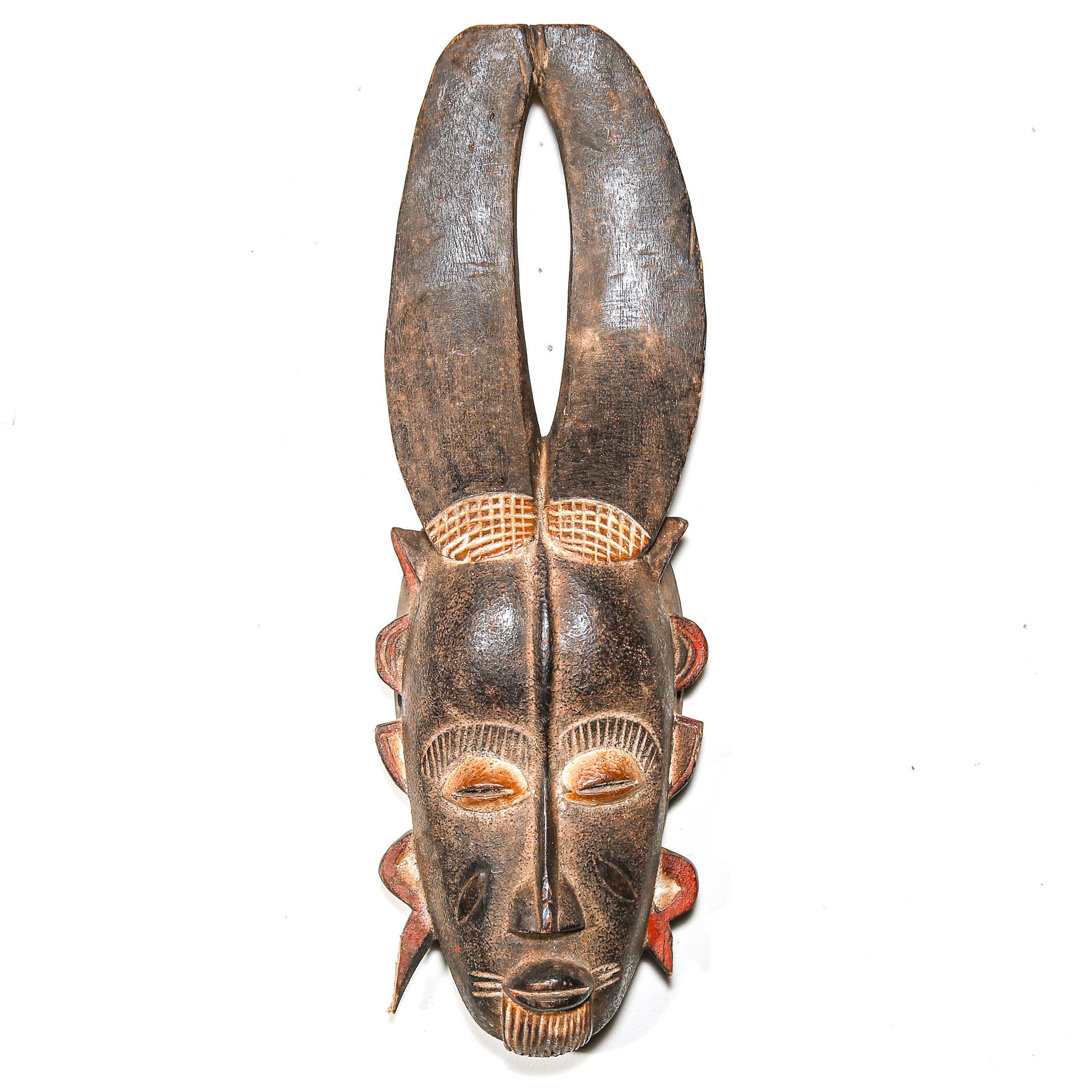 African mask with long ears on a white background