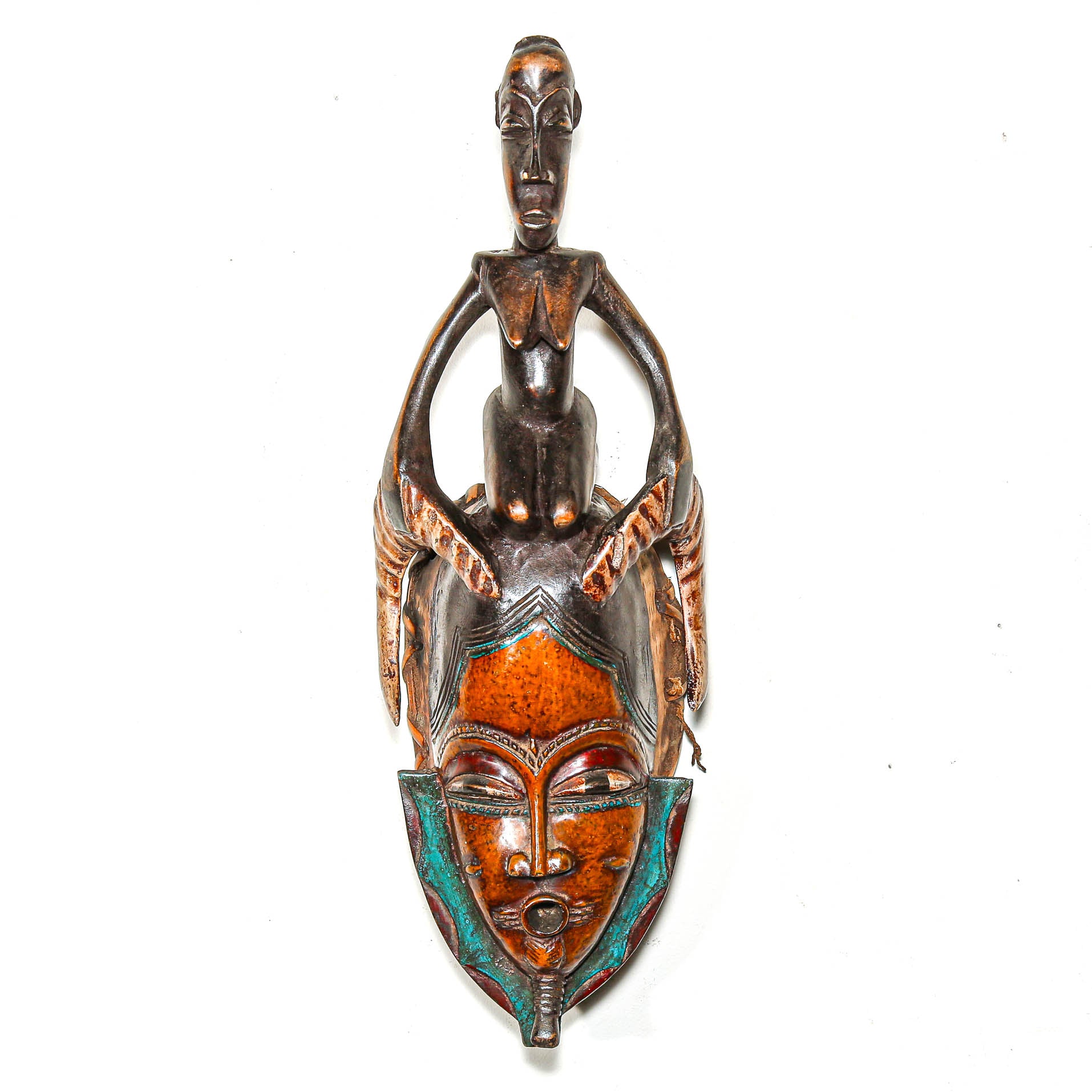 Decorative wall art with a figure and mask design on a white background