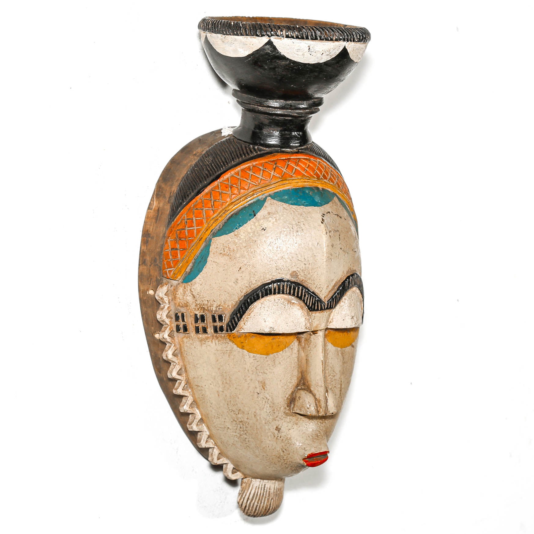 Decorative vase shaped like a face with artistic design on a white background