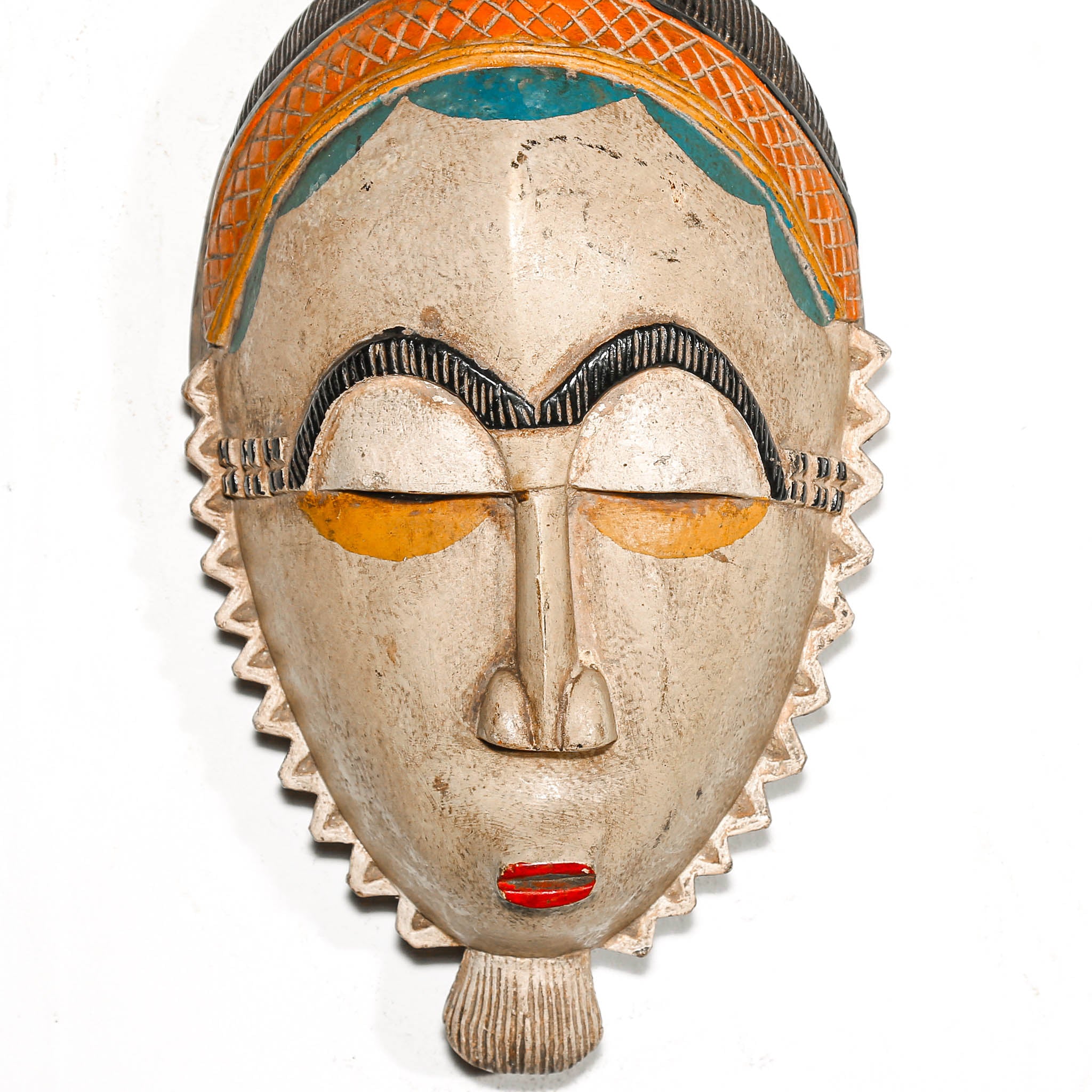 Decorative mask with a white face, red lips, and colorful top on a white background