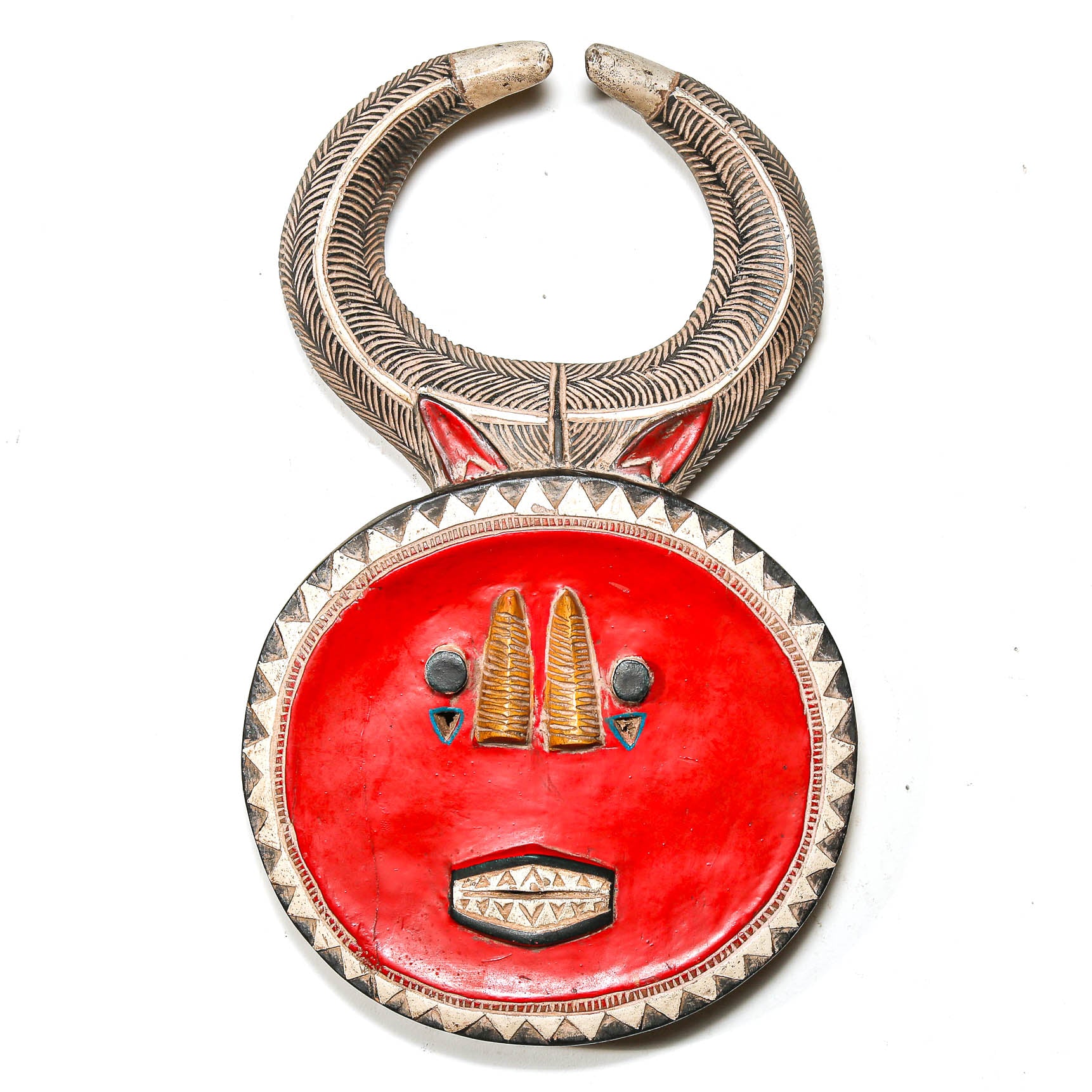 Decorative necklace with red circular pendant and silver accents on a white background