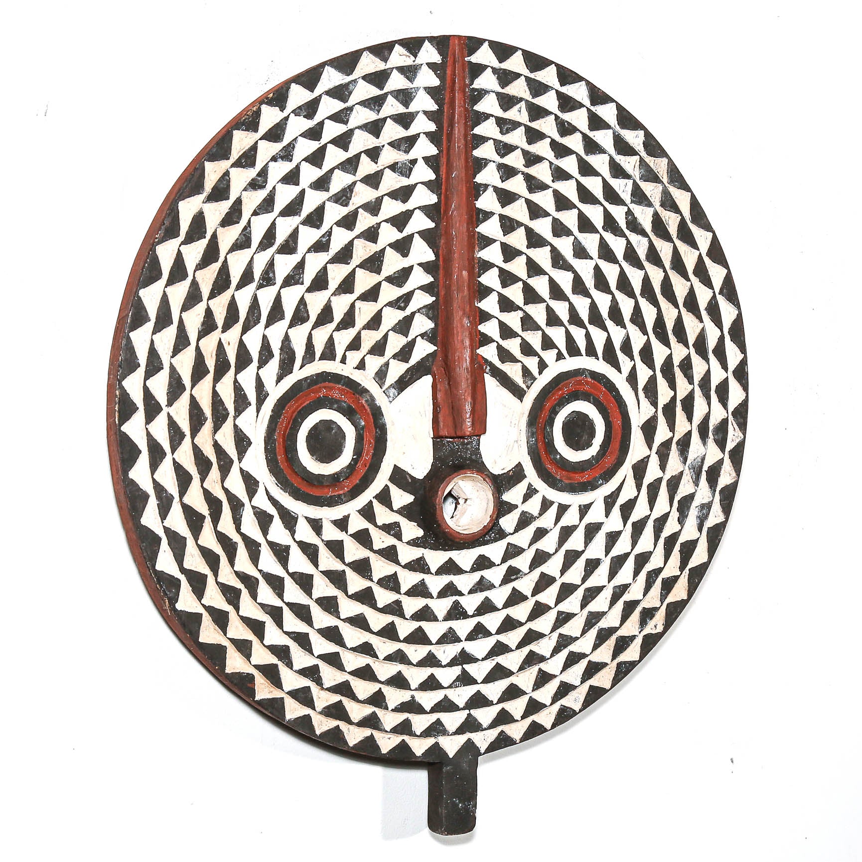 Decorative wall design from Africa with geometric pattern and red accents on a white background