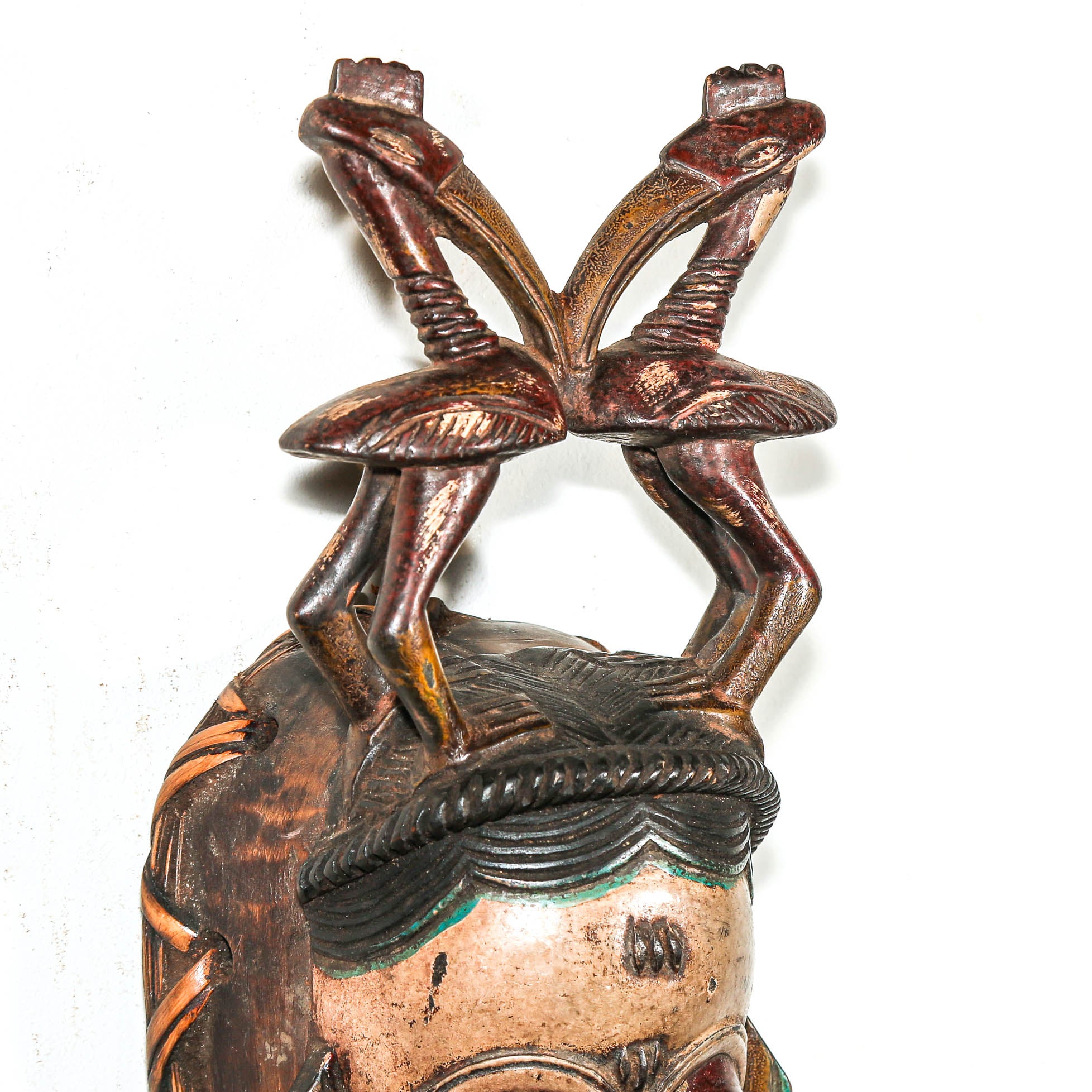 two birds on a ceremonial wood mask from africa 