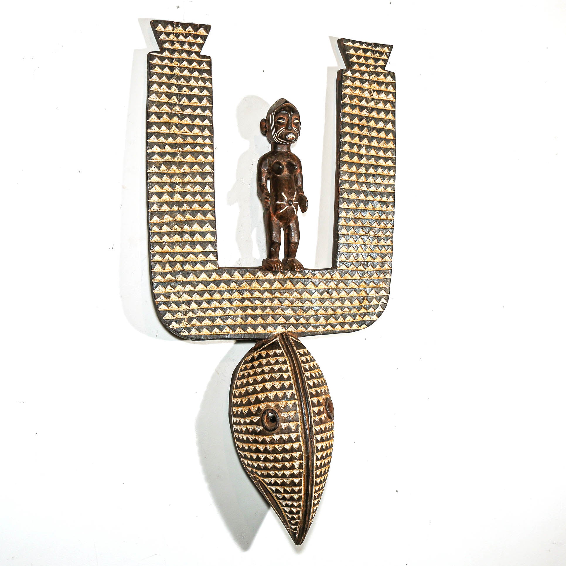 Decorative wall art with a figure and geometric design on a white background