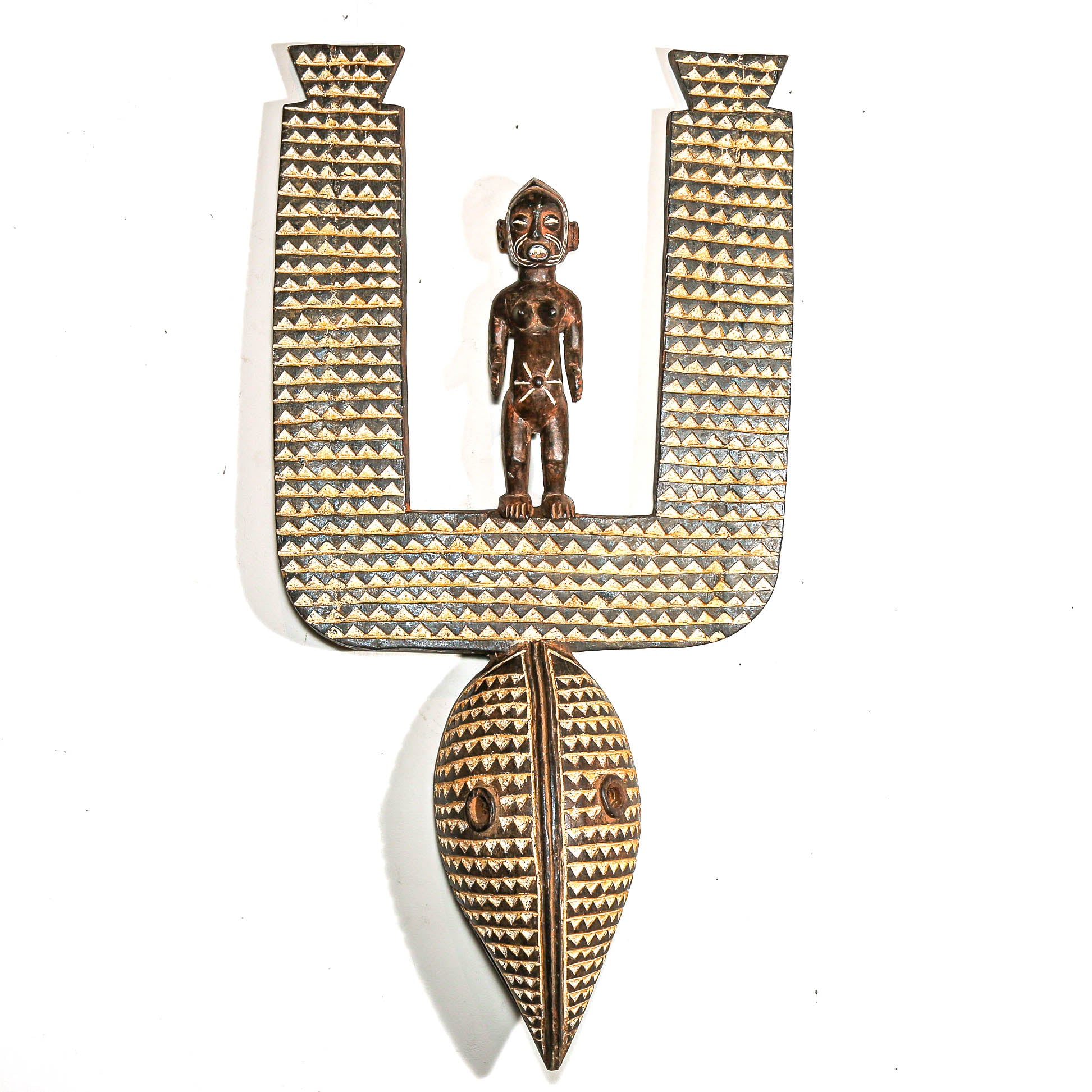 Decorative letter 'U' with a figurine on a white background