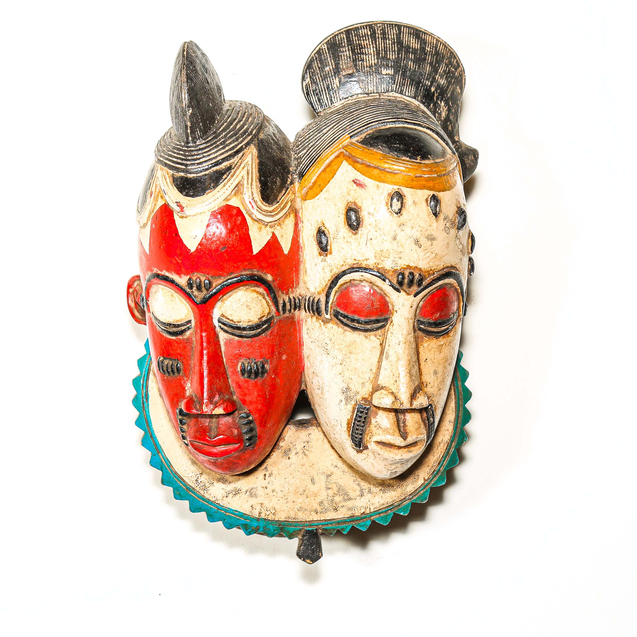 Pair of colorful decorative masks with red and beige faces on a white background