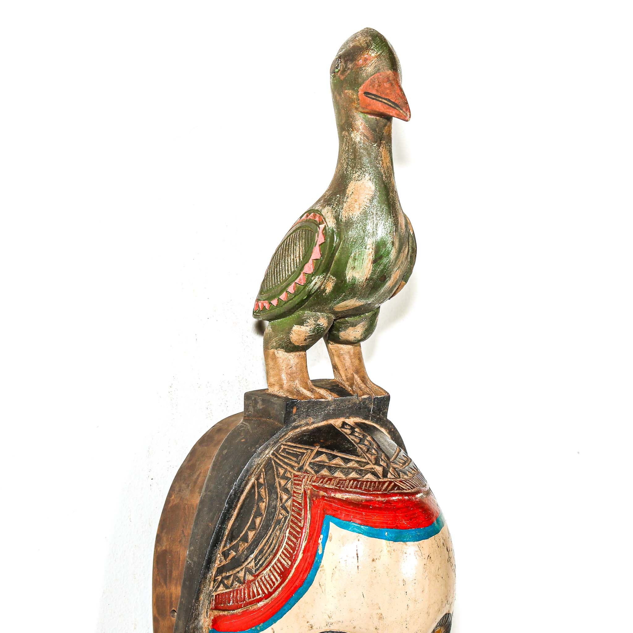 Decorative wooden goose figure on a white background rustic African decor