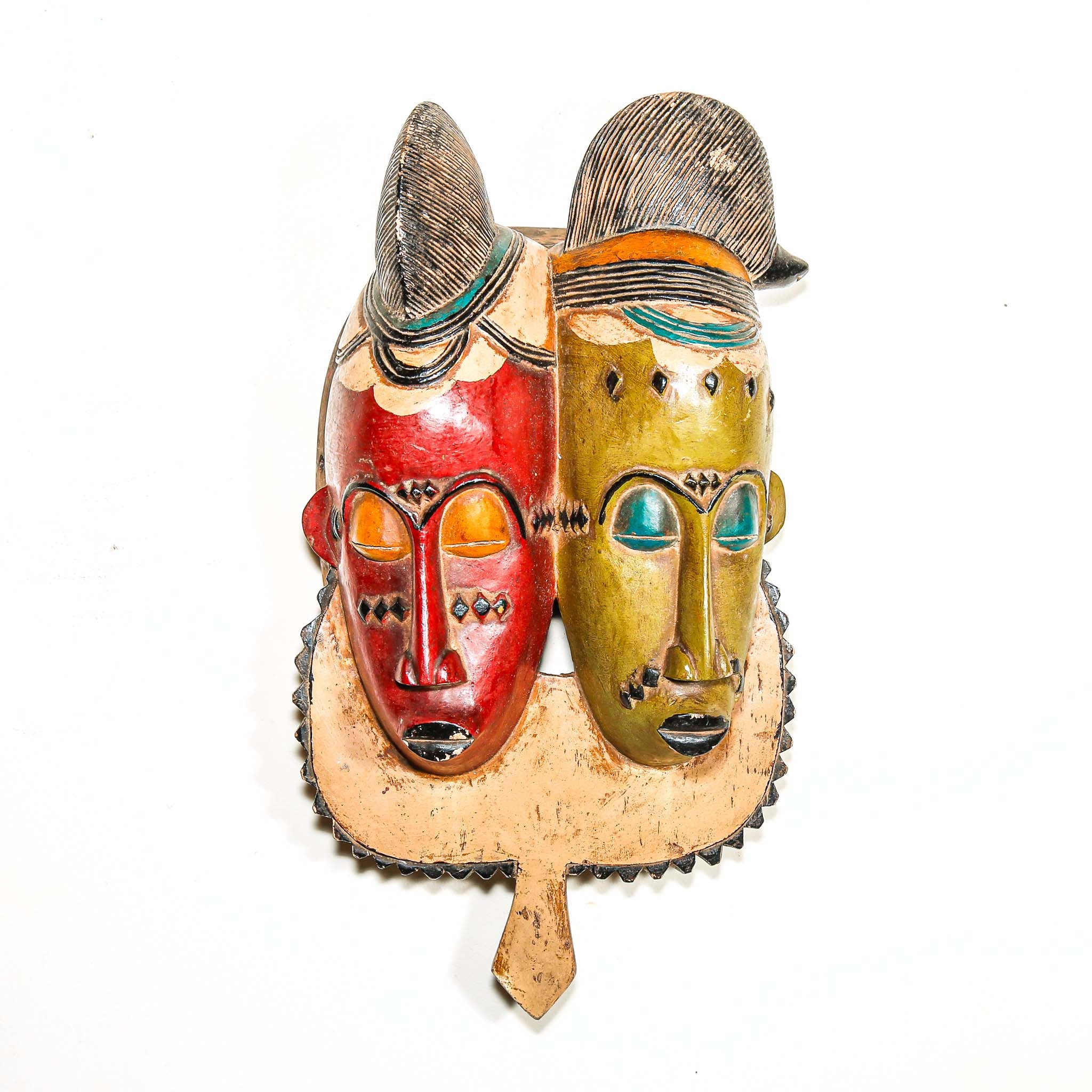 Colorful wooden tribal mask with two faces on a white background