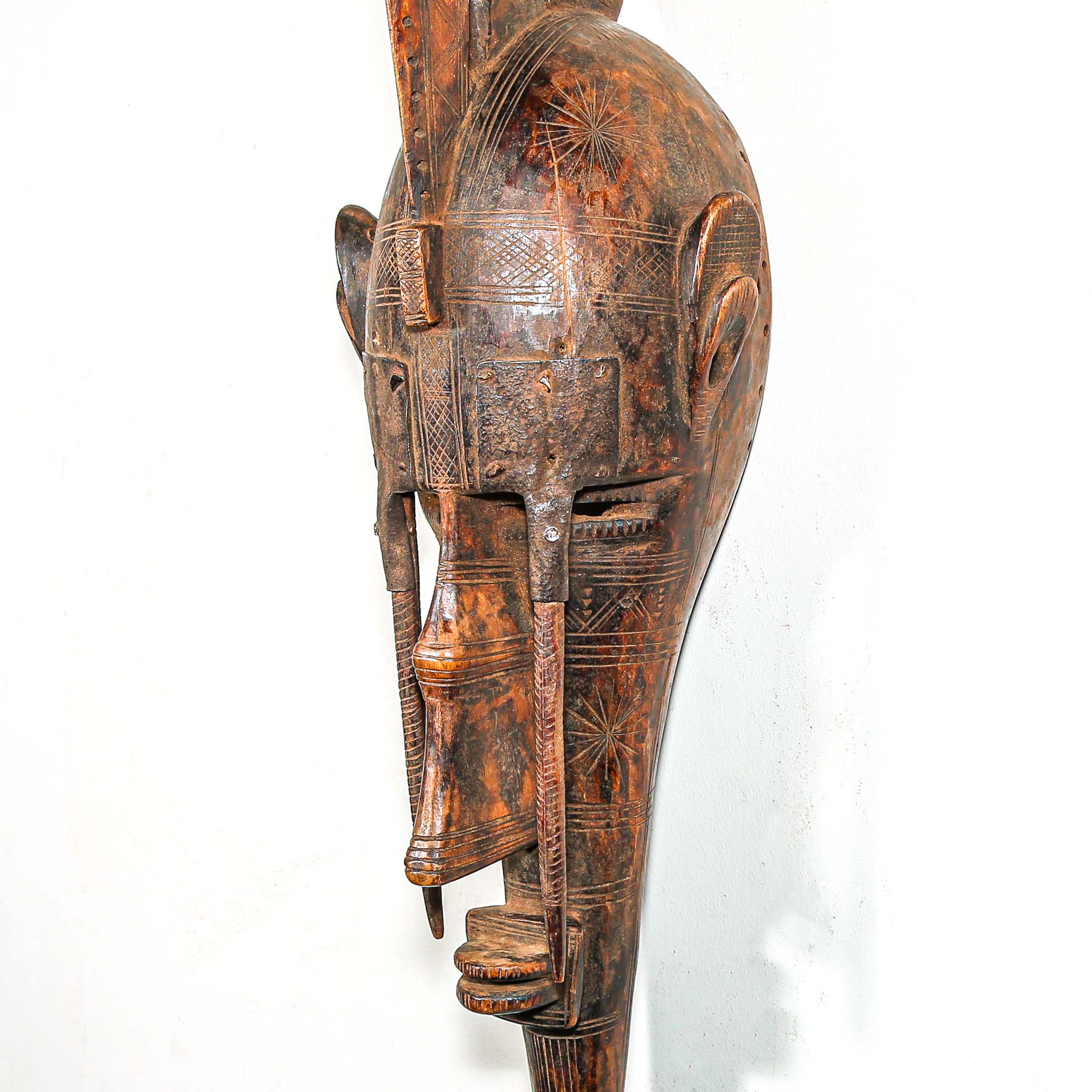 African Wooden and metal mask with intricate carvings for sale online