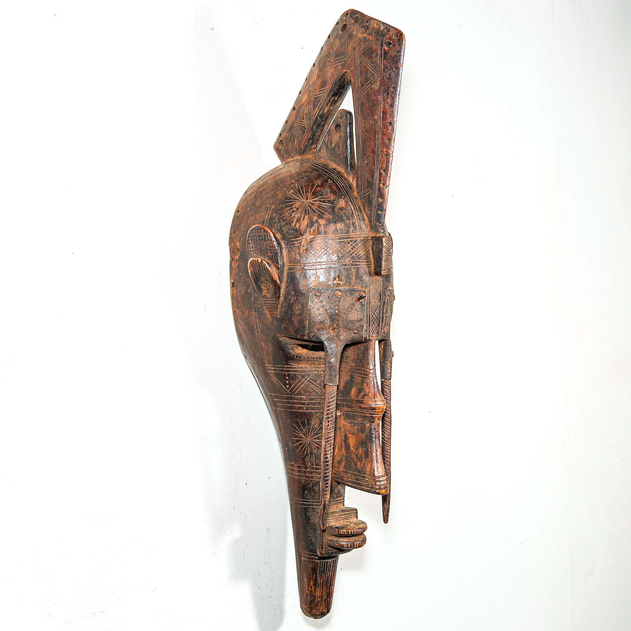 African Wooden and metal mask with intricate carvings for sale online