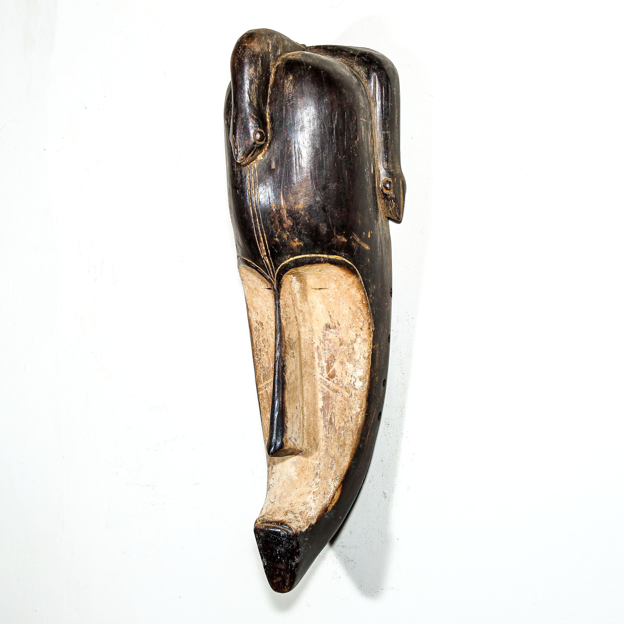 Wooden African vintage mask with modern face design for sale to display in the home