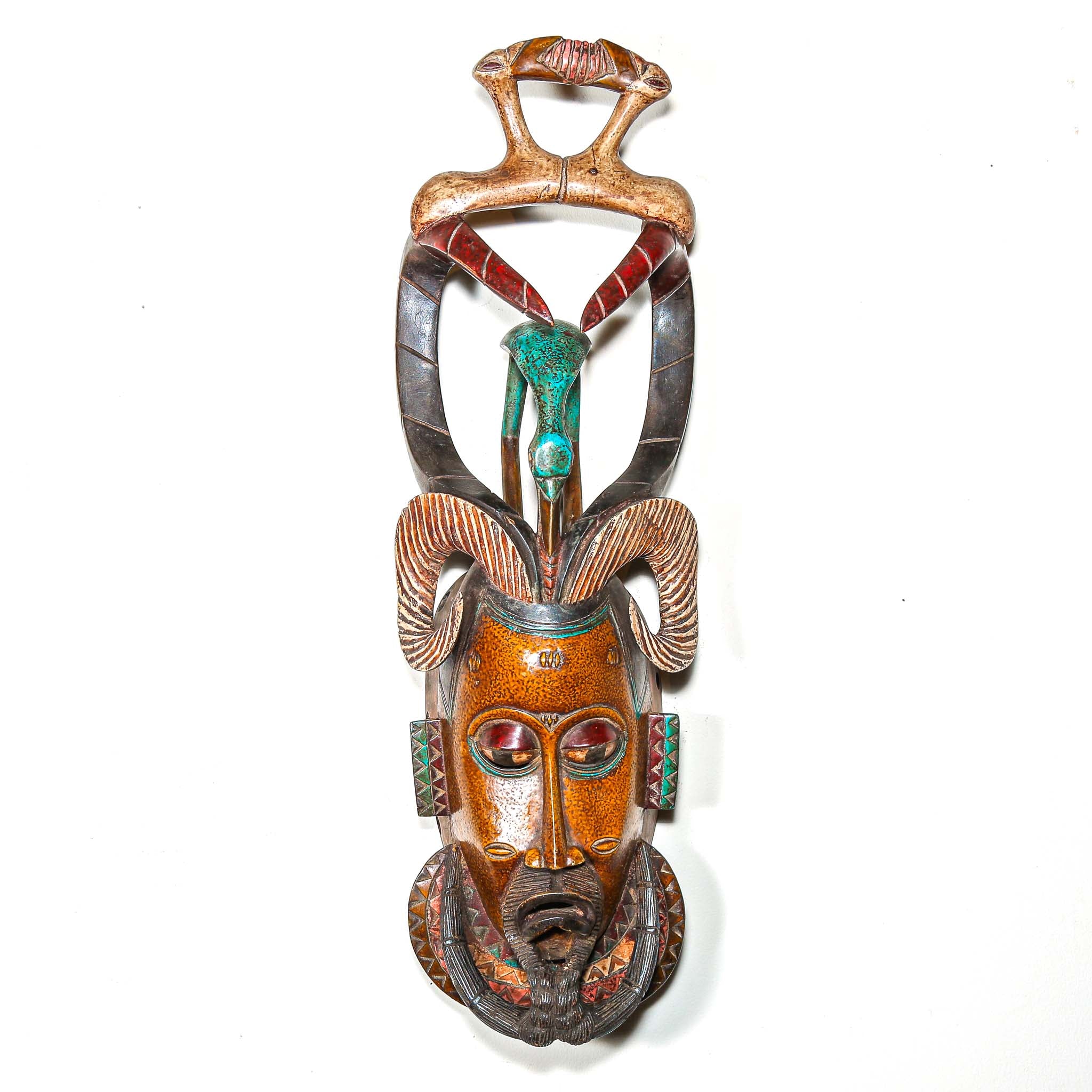 Authentic African mask to purchase online with colorful designs on a white background