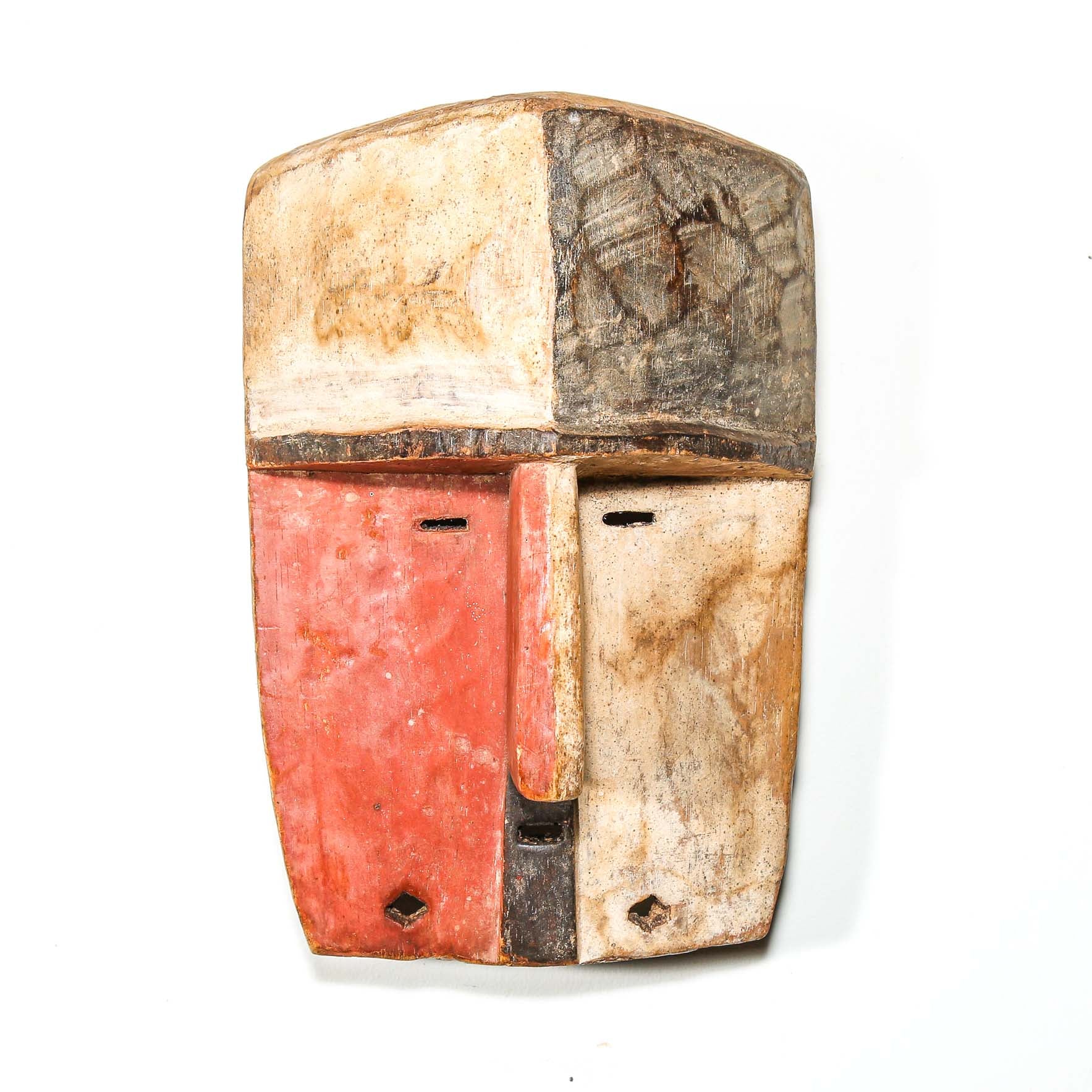 vintage Wooden African mask for sale with a checkered pattern on a white background