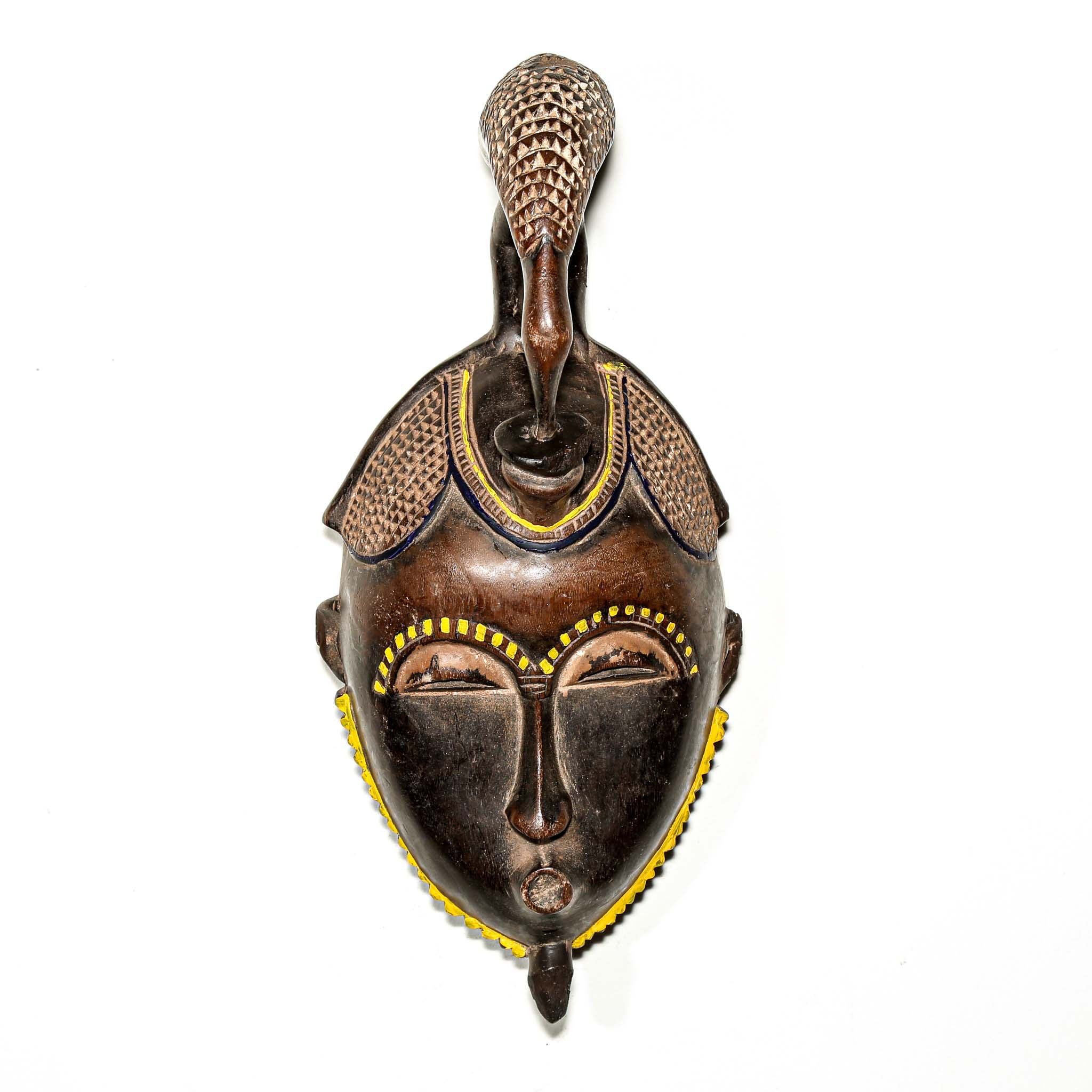brown ceremonial African mask with intricate yellow painted designs for Sale