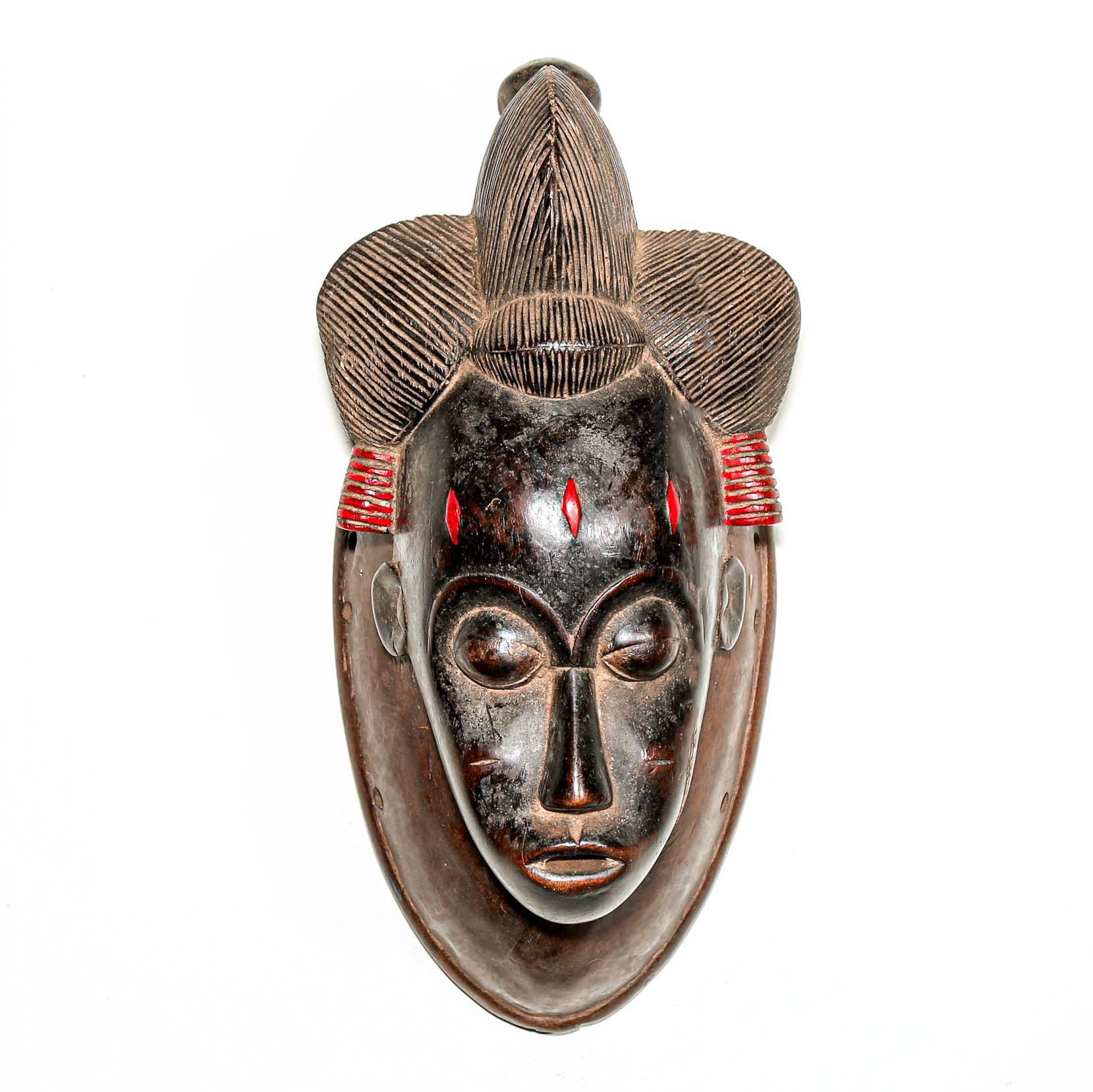 Black African mask with red details to hang on the wall