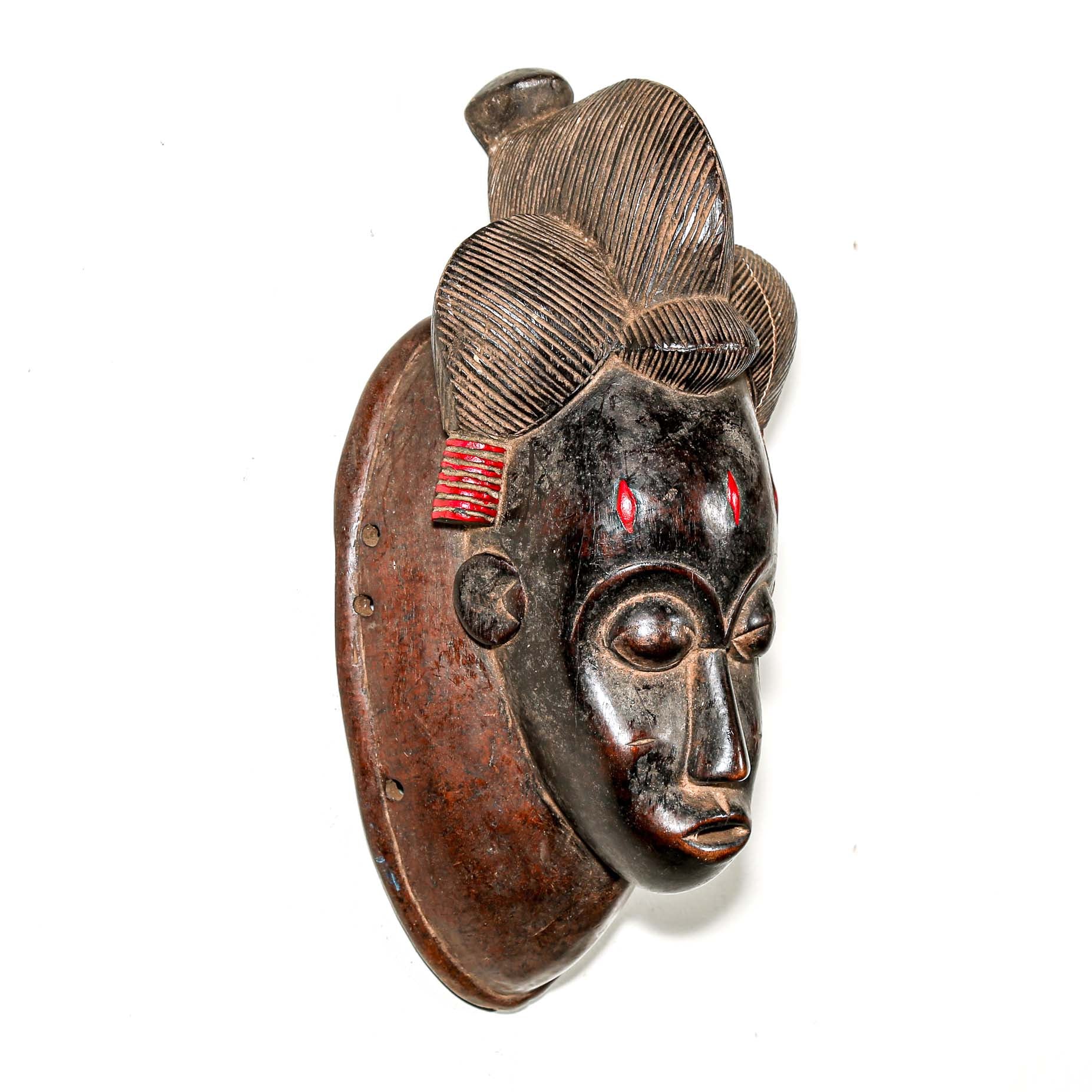 Black African mask with red details to hang on the wall