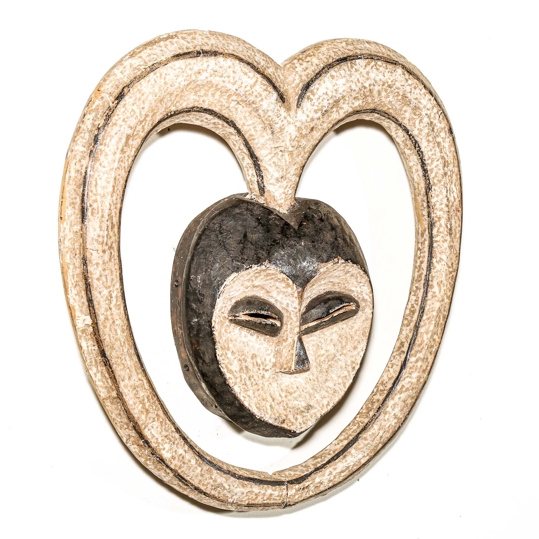 Decorative heart-shaped African mask with a face design on a white background African art for sale