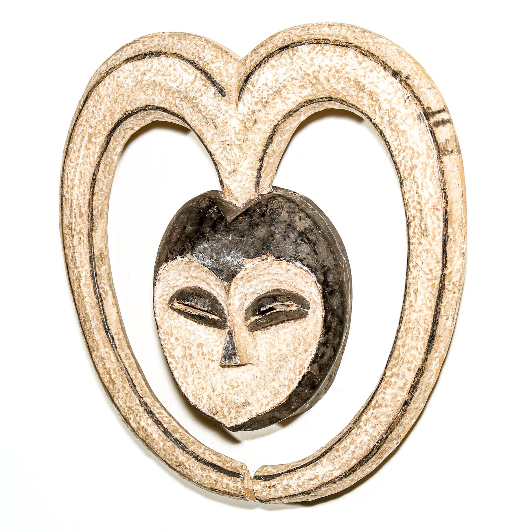 Decorative heart-shaped African mask with a face design on a white background African art for sale
