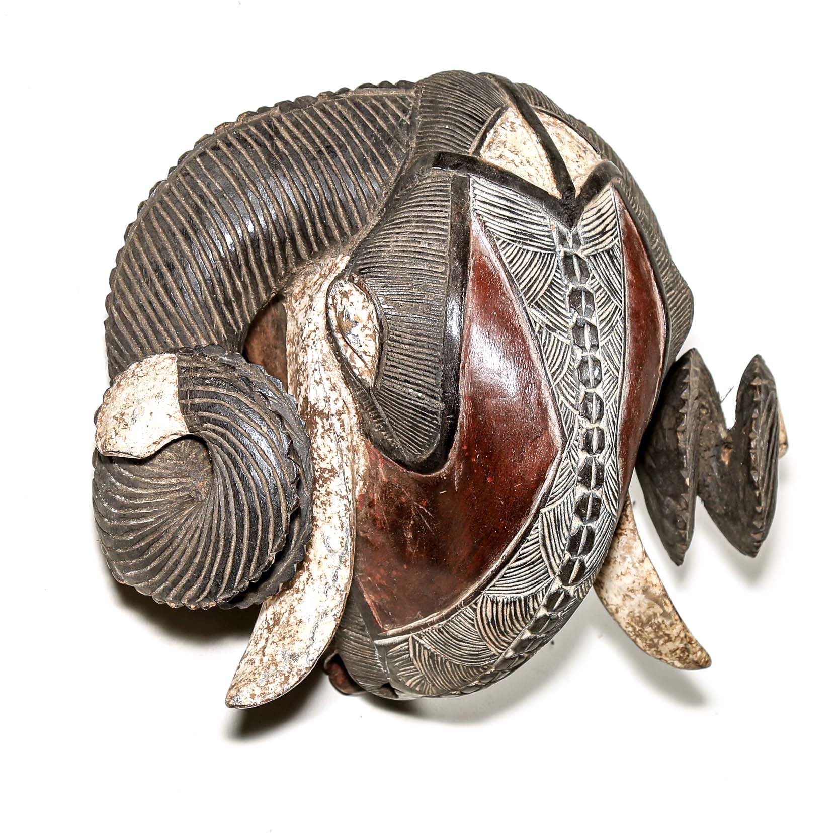 Decorative wall piece with intricate designs on a white background