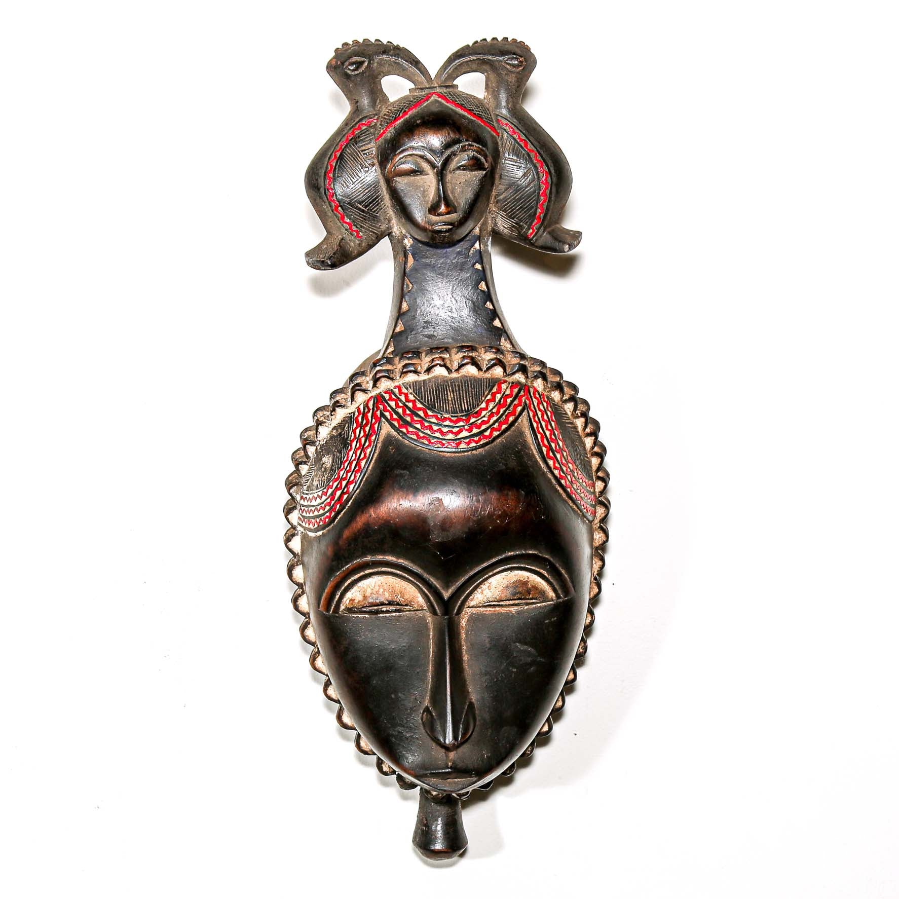 Brown African mask with red painted wood. Wall decor ideas for the home