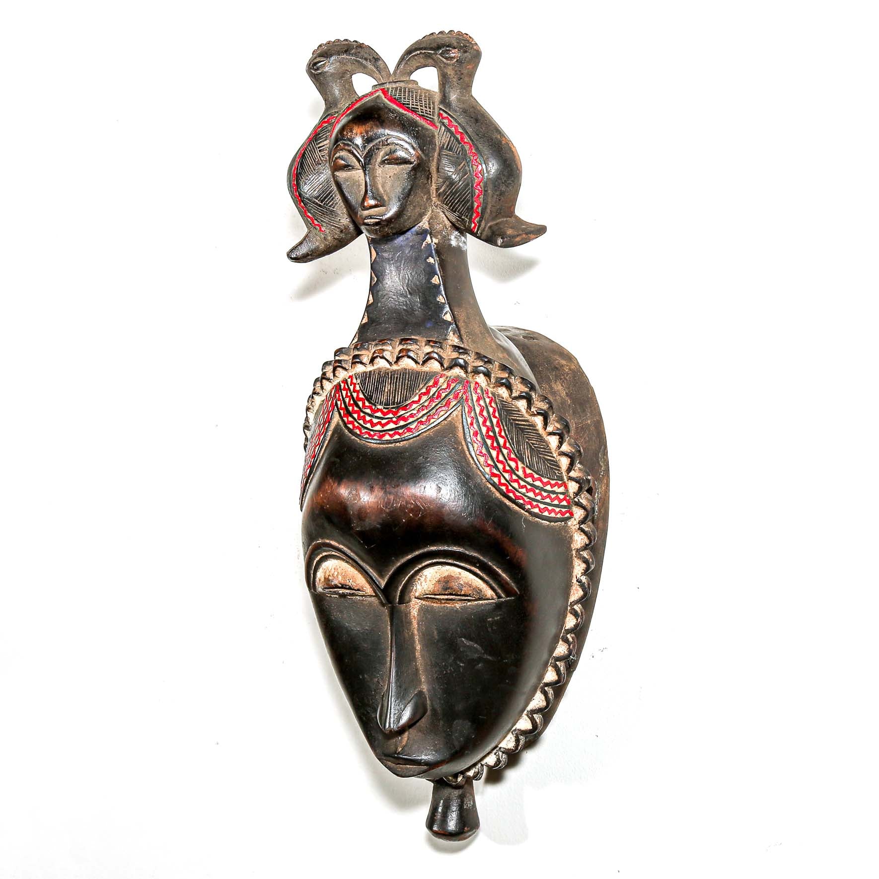 Brown African mask with red painted wood. Wall decor ideas for the home