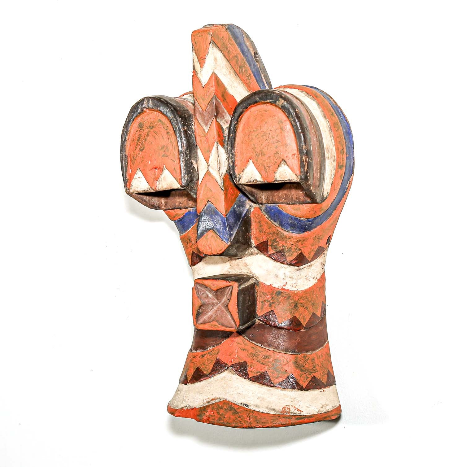 Decorative wooden glove with geometric patterns on a white background