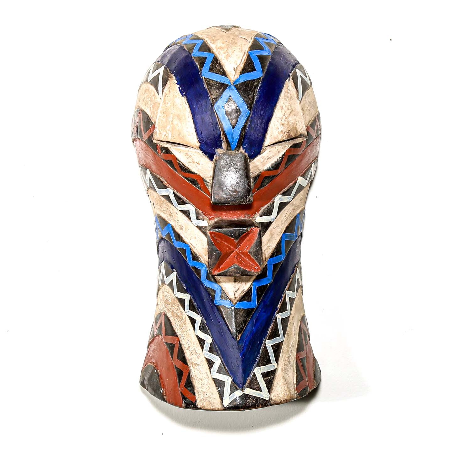 Colorful modern tribal art from African for sale. Songye ceremonial mask hanging on a white wall