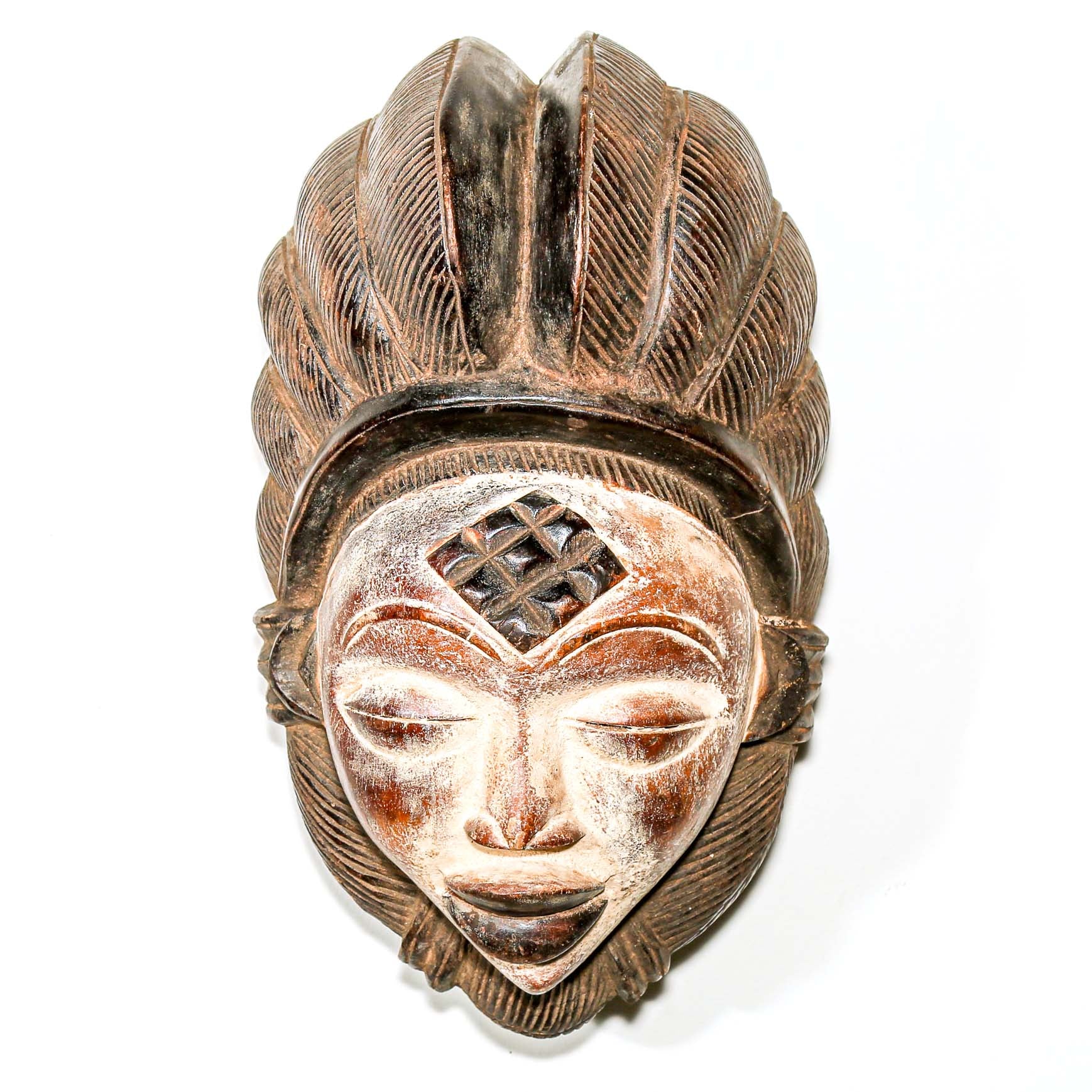 traditional tribal mask as African art to hang on the wall for Modern art decor 