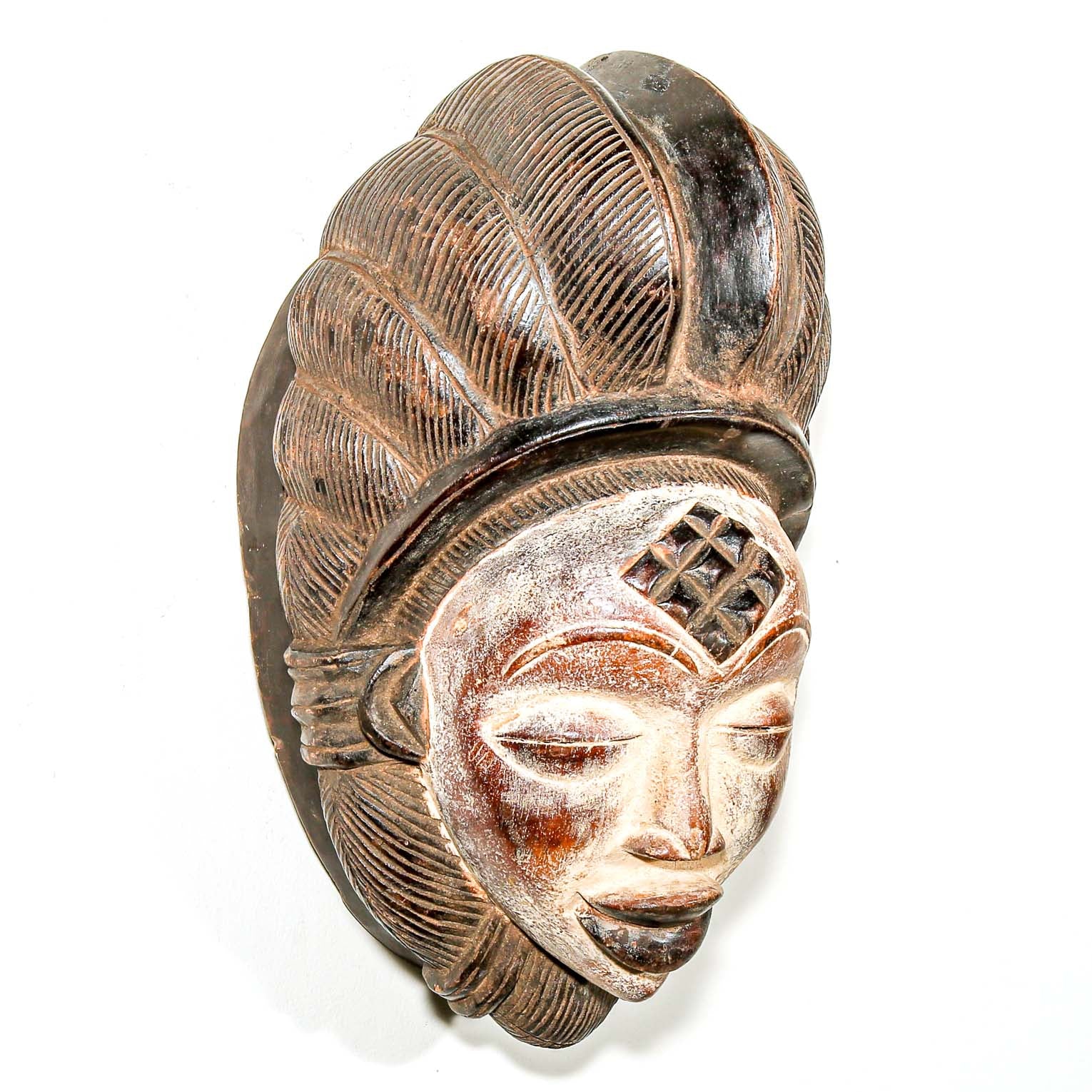 traditional tribal mask as African art to hang on the wall for Modern art decor 