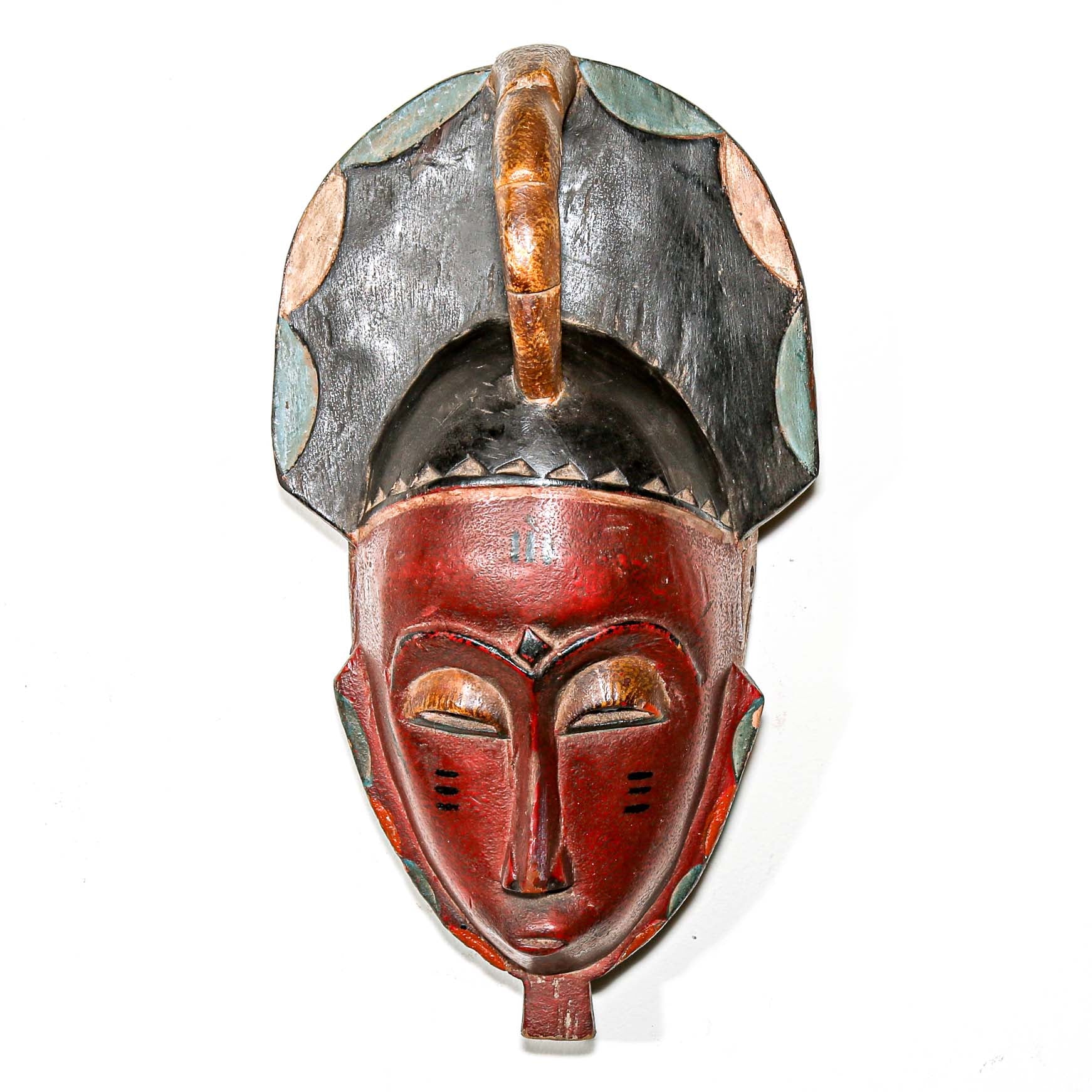 Red collectable African tribal mask for modern interior design ideas