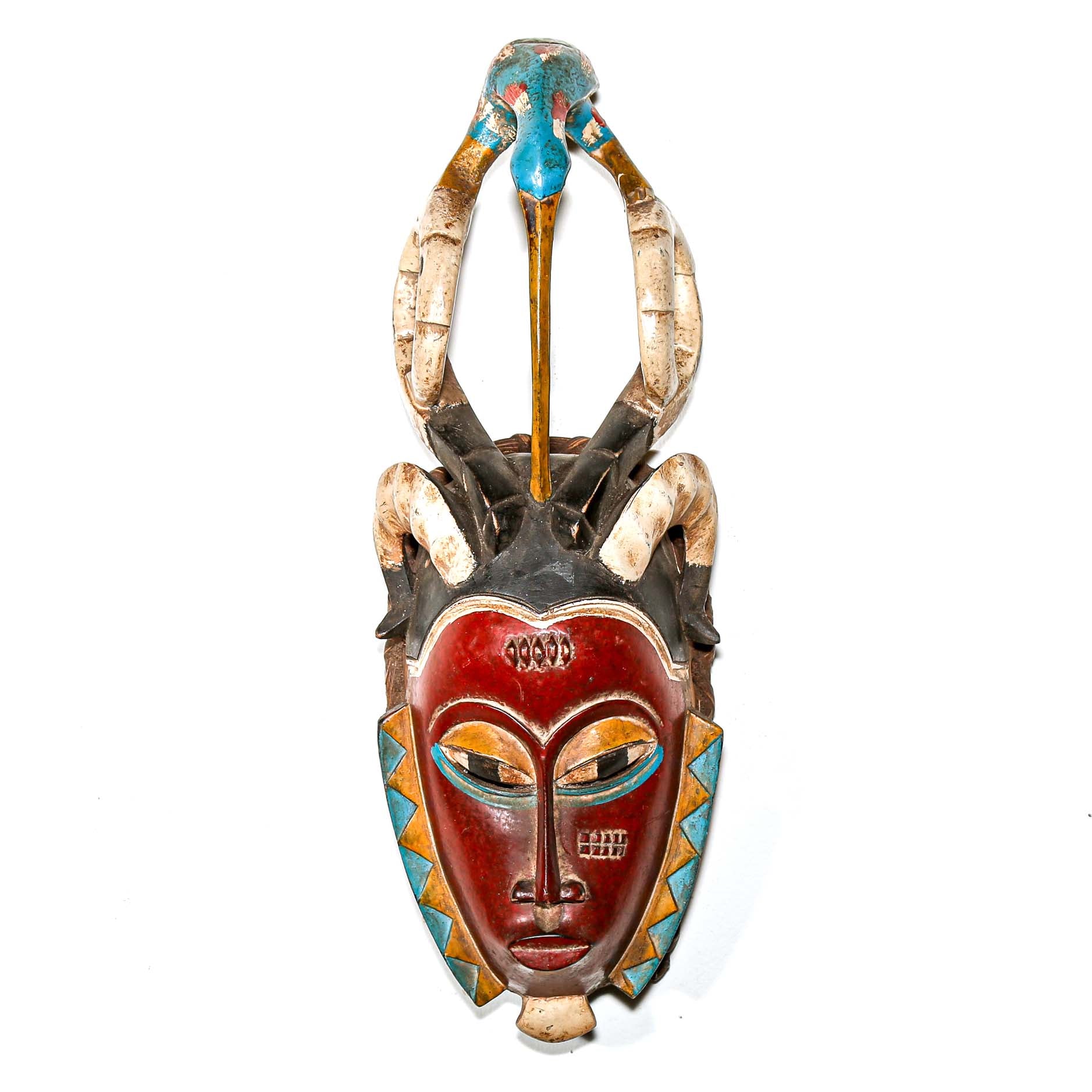 Decorative mask with red face, blue and gold accents on a white background