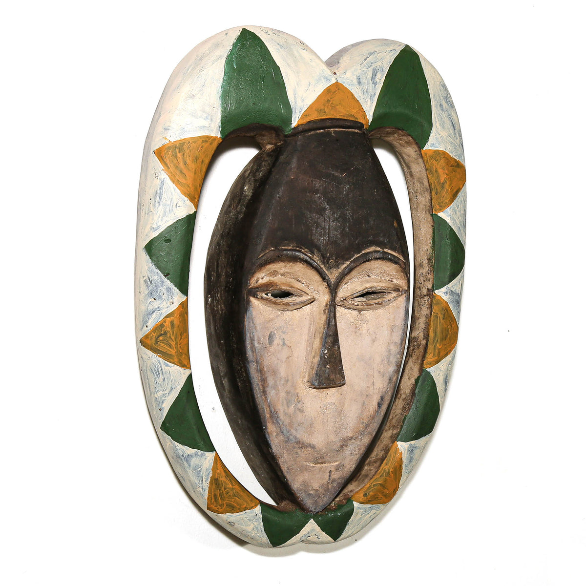 Painted Kwele mask with green, yellow, and white geometric patterns and elegant carved facial features