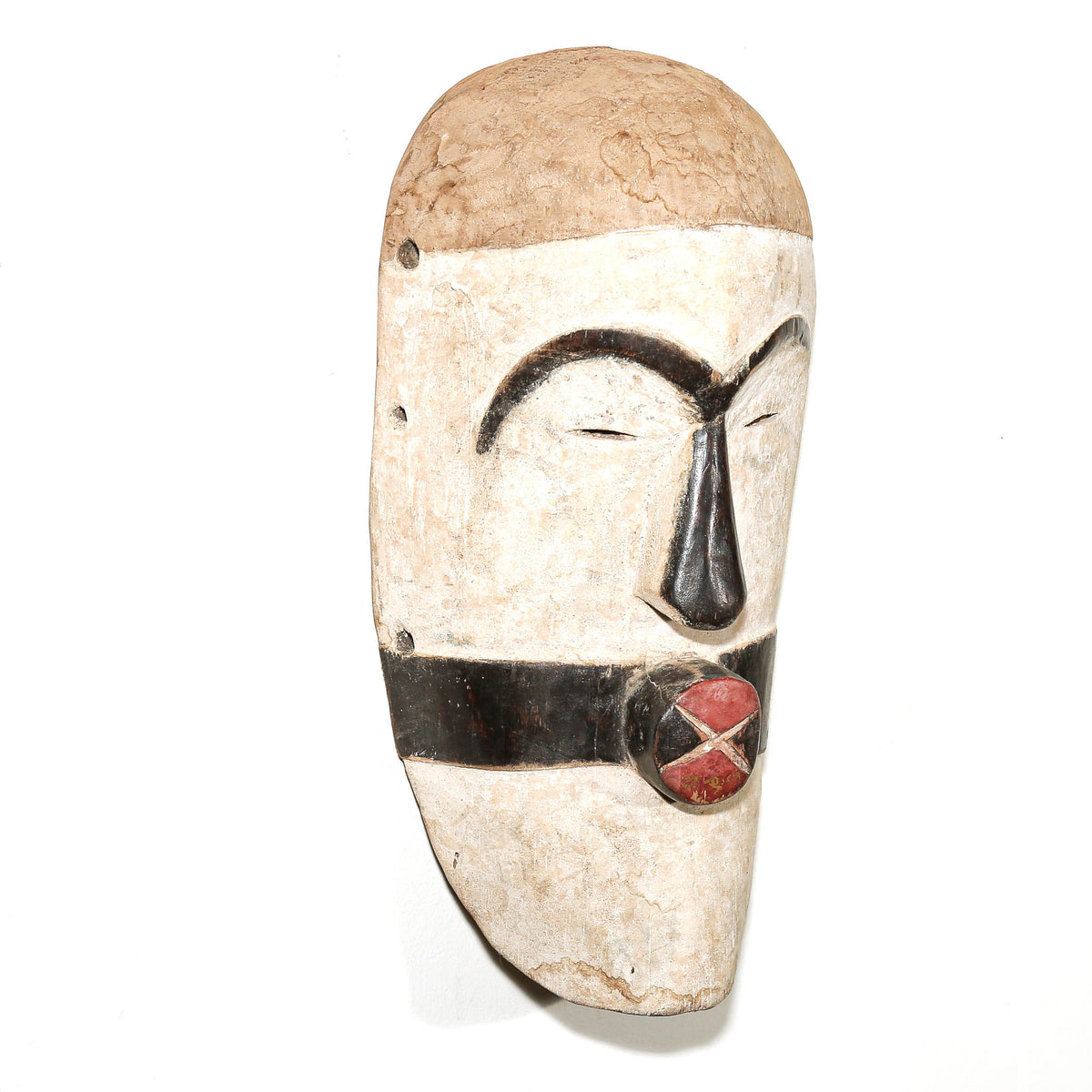 black and white African mask in the modern Songye style to hang on the bedroom wall for protection