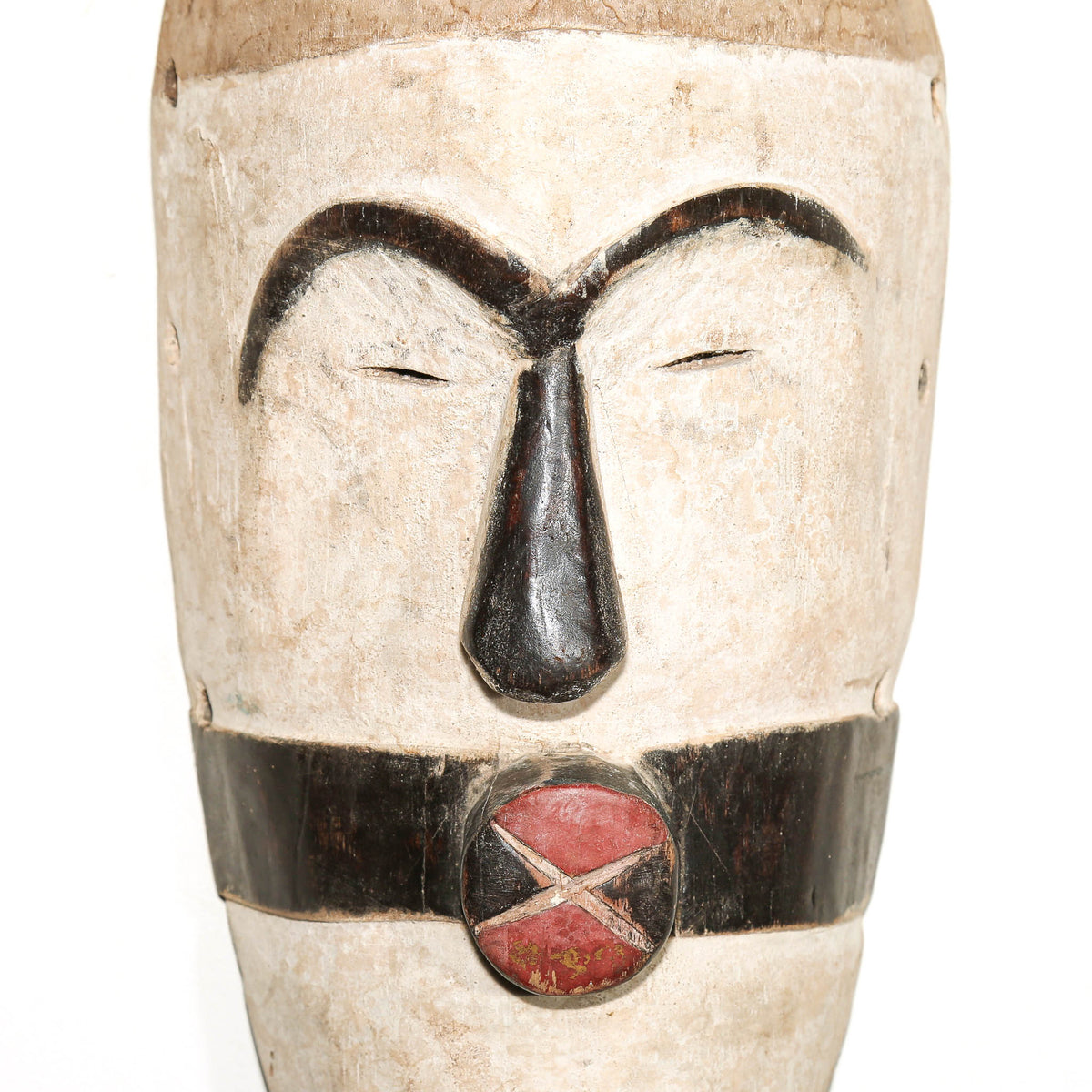 black and white African mask in the modern Songye style to hang on the bedroom wall for protection
