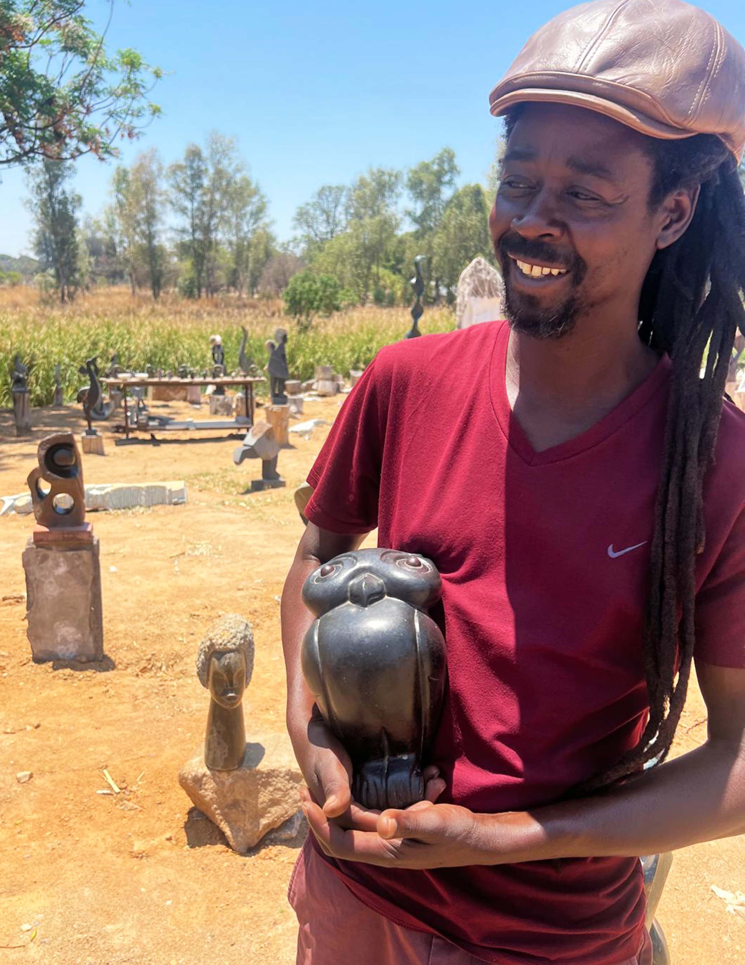 "Observant Owl" Sculpture Carved in Black Stone in the hands of the Shona artist